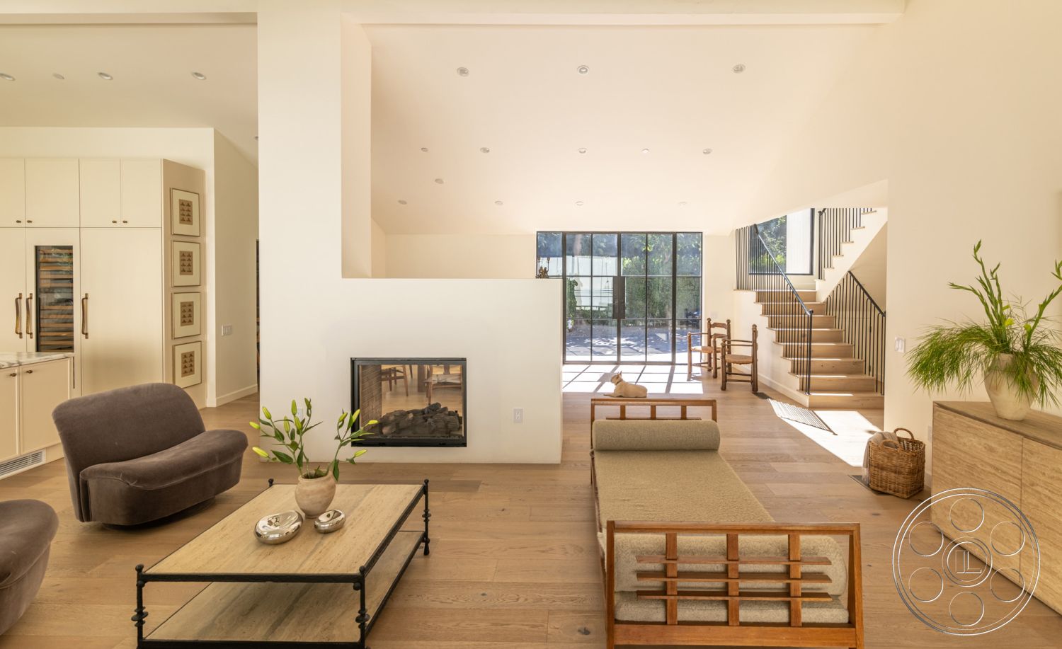 Modern Farmhouse 19 - neutral color palette, large glass windows, textured wall accents, cozy reading nook, functional kitchen layout, minimalist decor elements, interior hardwood flooring, natural light-filled space, open concept living area, interior white painted walls, exposed wood beam ceiling, black metal stair railings, geometric shapes in furniture, contemporary lounge chairs, fireplace feature wall, modern coffee table design, plant decor for indoor setting, inviting living room atmosphere