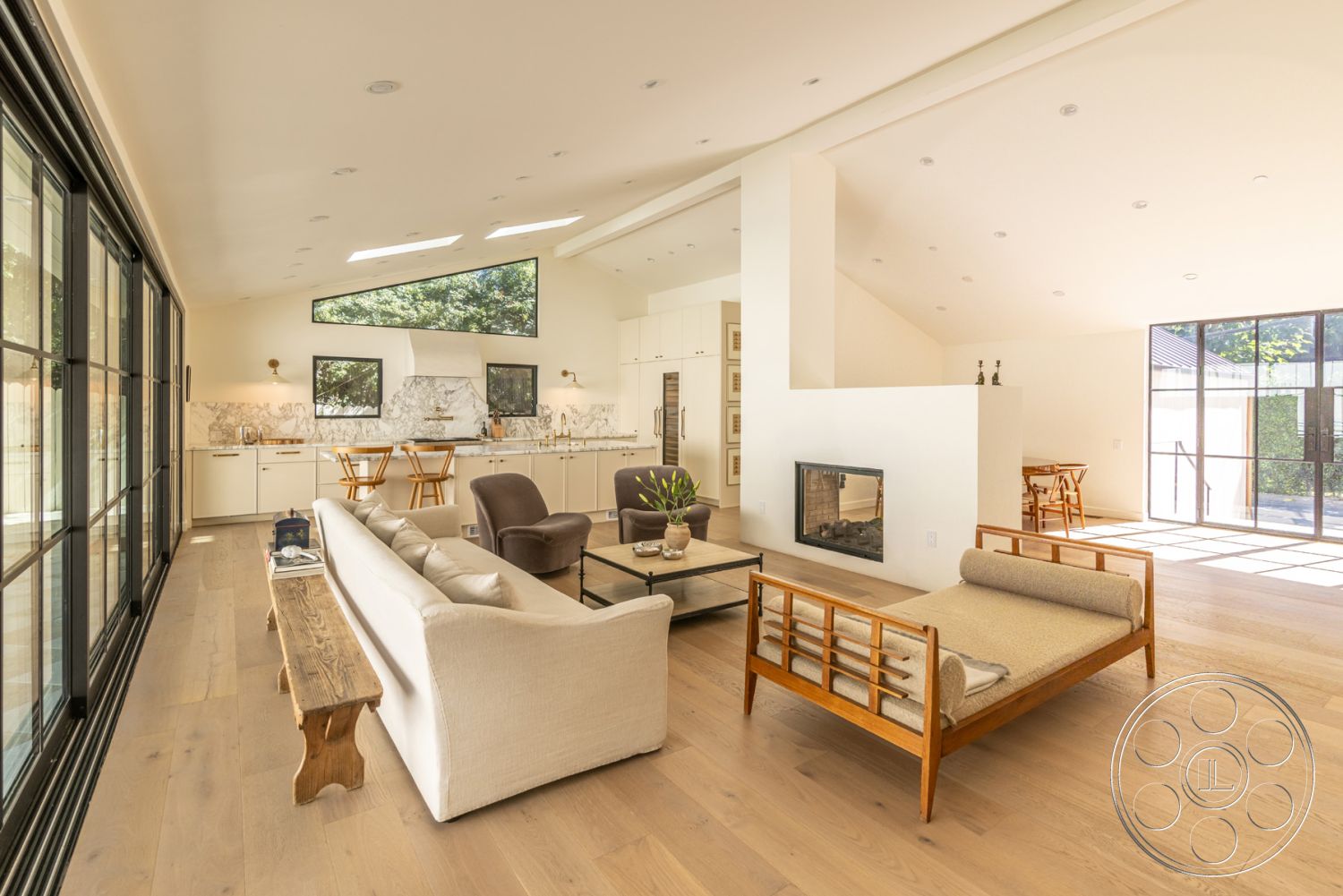 Modern Farmhouse 19 - interior vaulted ceiling, interior neutral color palette, interior hardwood flooring, interior exposed wood ceiling beams, interior open concept layout, interior white painted walls, interior minimalist design elements, interior natural light ambiance, interior contemporary dining area, interior mid-century modern furniture, interior quartz kitchen countertops, interior marble backsplash, interior modern fireplace design, interior large casement windows, interior bespoke cabinetry