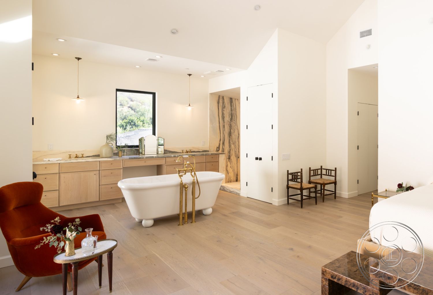 Modern Farmhouse 19 - freestanding bathtub, floor-to-ceiling windows, open concept living space, sloped ceiling, pendant lighting fixtures, hardwood bedroom floors, white painted walls, marble bathroom countertops, natural light-filled room, urban hillside setting, textured wood accent wall, minimalistic interior design, modern contemporary style, luxurious spa-like bathroom, gold bathroom fixtures, two-toned cabinetry, simple chair furniture