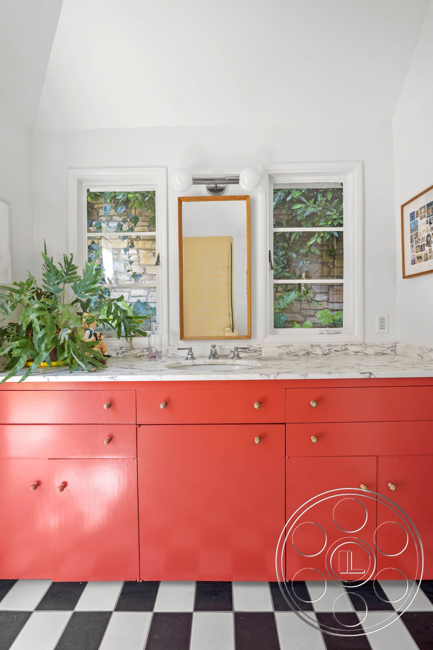 English 60 - modern light fixtures, minimalist design elements, marble countertop, framed wall art, natural light from windows, double-hung windows, interior bathroom, greenery indoor plants, hidden storage compartments, red lacquered cabinets, black and white checkered tile flooring, white vaulted ceiling, vanity mirror with light