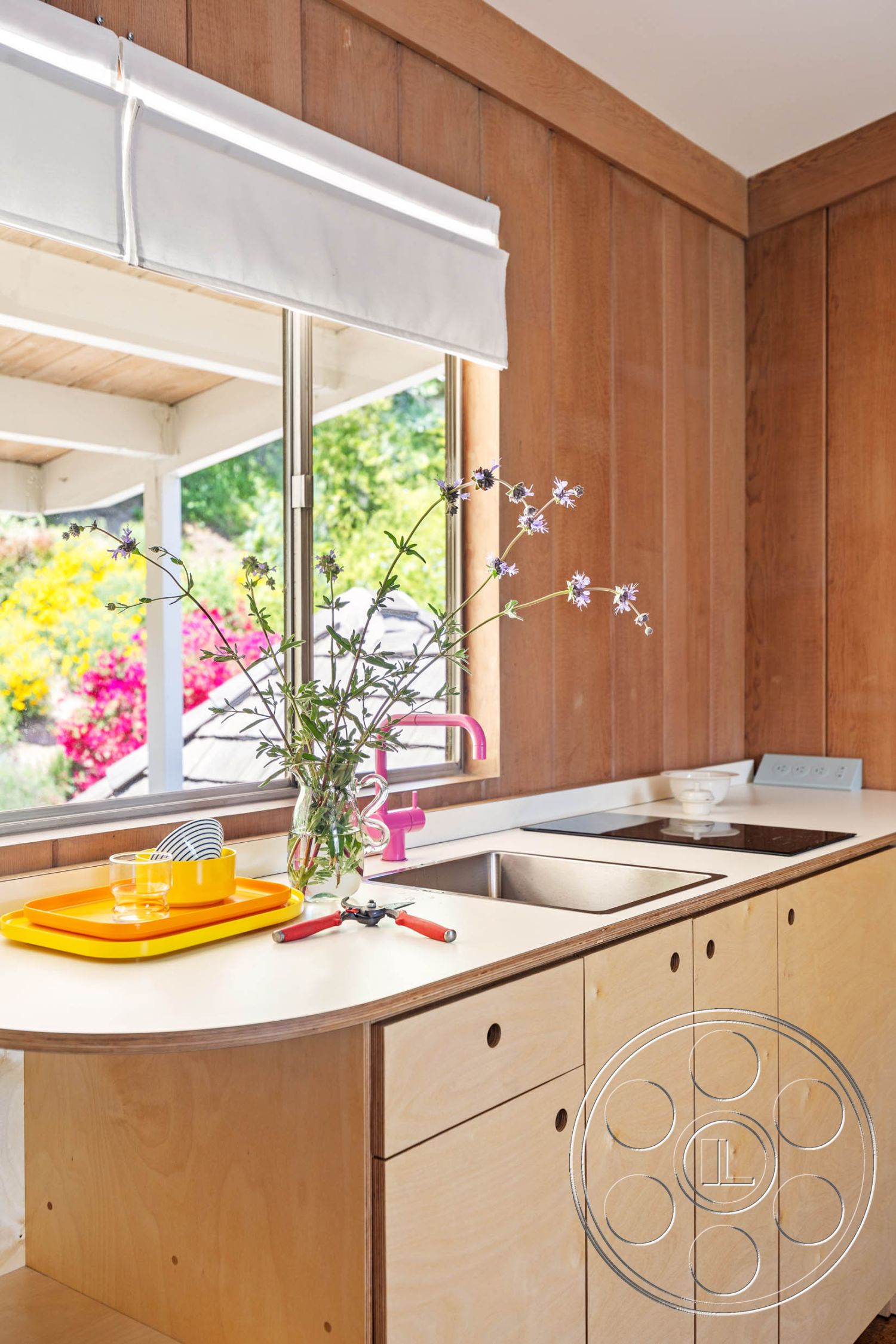 English 60 - interior textured wall treatment, interior wood paneling walls, interior undermount sink, interior modern faucet, interior bright color accents, interior minimalist kitchen design, interior plywood cabinetry, interior solid surface countertop, interior circular kitchen island, interior garden view window, interior contemporary kitchen, interior functional kitchen layout, interior casual dining area