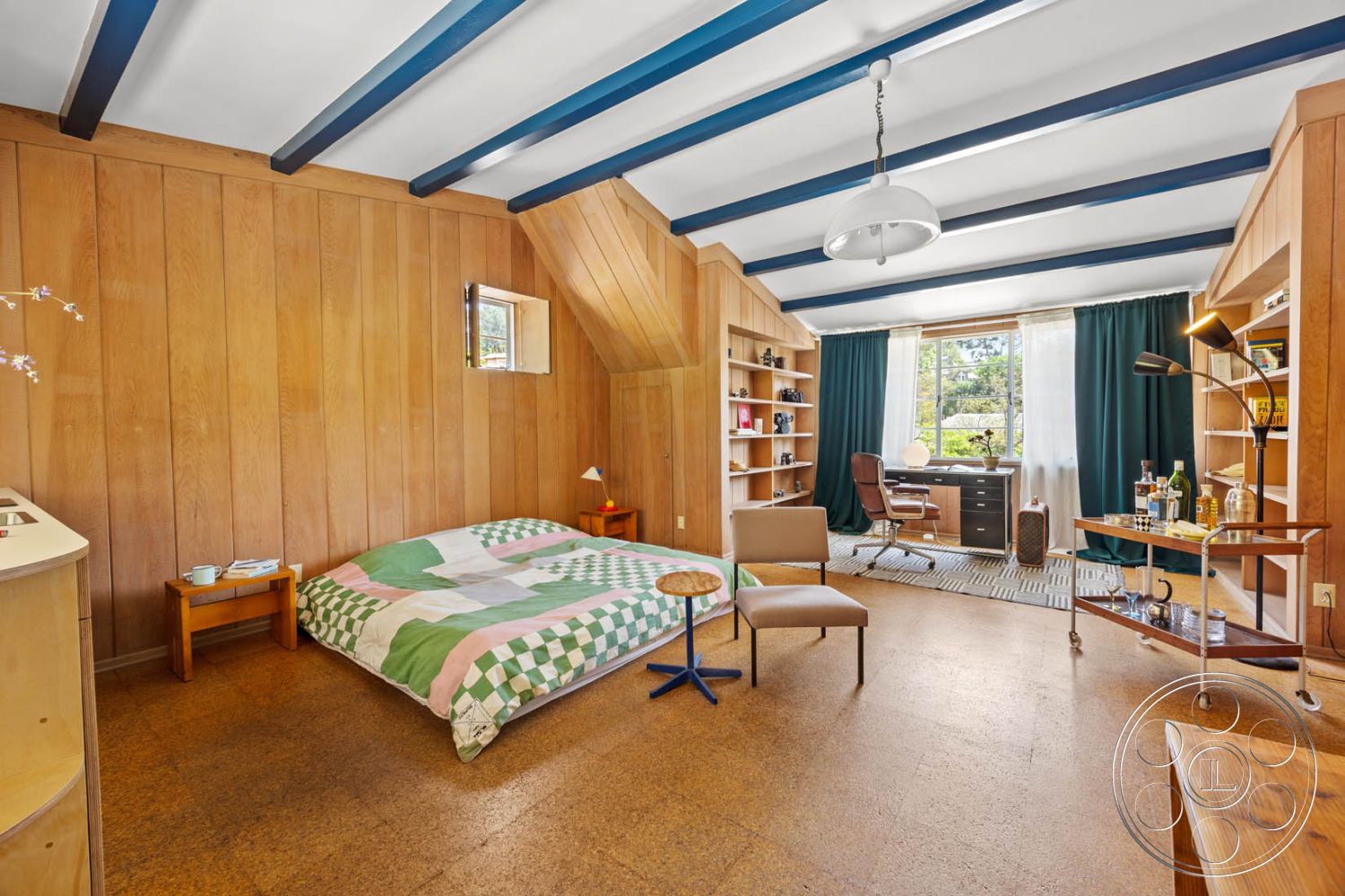 English 60 - decorative light fixture, exposed wood ceiling beams, mid-century modern accent chair, white painted ceiling, open shelving for books and decor, minimalist side table, interior hardwood paneling walls, interior cork flooring, modern desk workspace, light curtains with garden view, plaid bedspread in soft colors, rounded table for casual seating, window with small traditional accents, compact bedroom layout, dual-function sleeping and working space