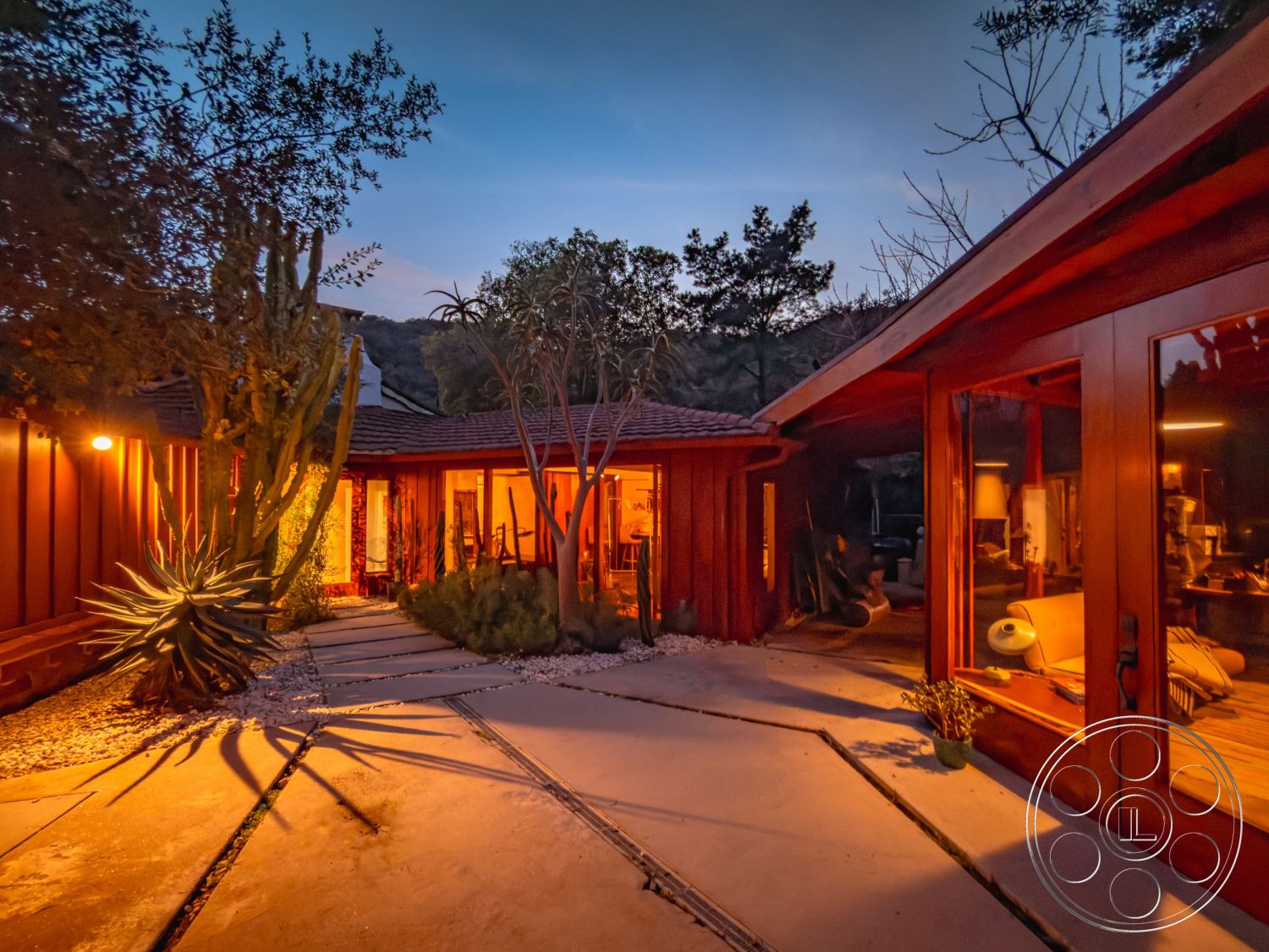 Pad 90210 - natural stone accents, landscaped courtyard, modern rustic style, ambient outdoor lighting, asymmetrical rooflines, floor-to-ceiling glass windows, stone garden planters, exterior wood siding, desert plants landscaping, desert landscape design, redwood exterior walls, flat concrete path, slate concrete accent paving, low-profile hardscaping, wraparound outdoor patio, open air courtyard