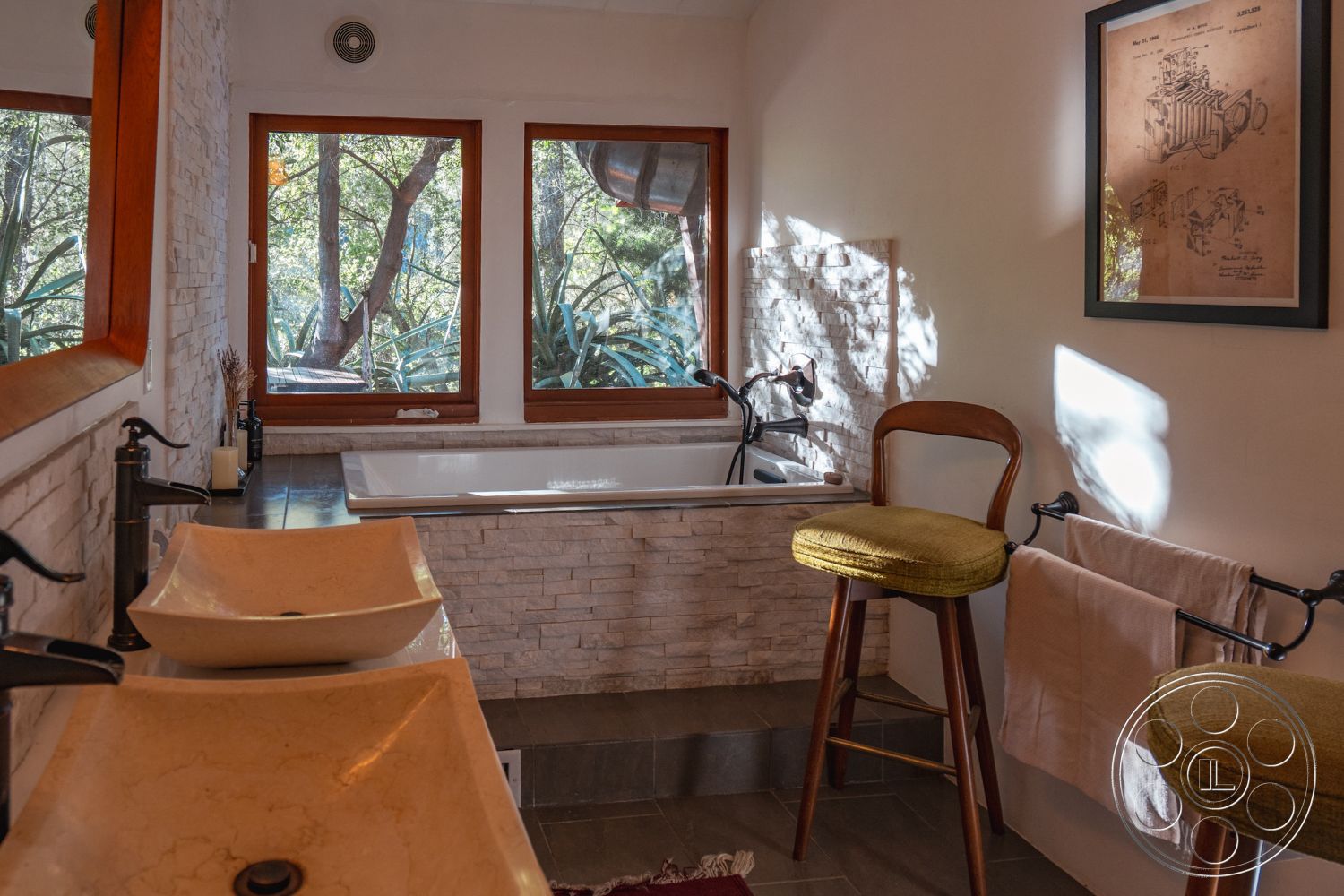 Pad 90210 - minimalist design, wooden bar stools, stone accent wall, open space layout, decorative wall art, gray tile flooring, plastered white walls, soft lighting ambience, interior bathroom, freestanding soaking bathtub, natural wood window frames, marble vessel sinks, black faucet fixtures, window view with greenery