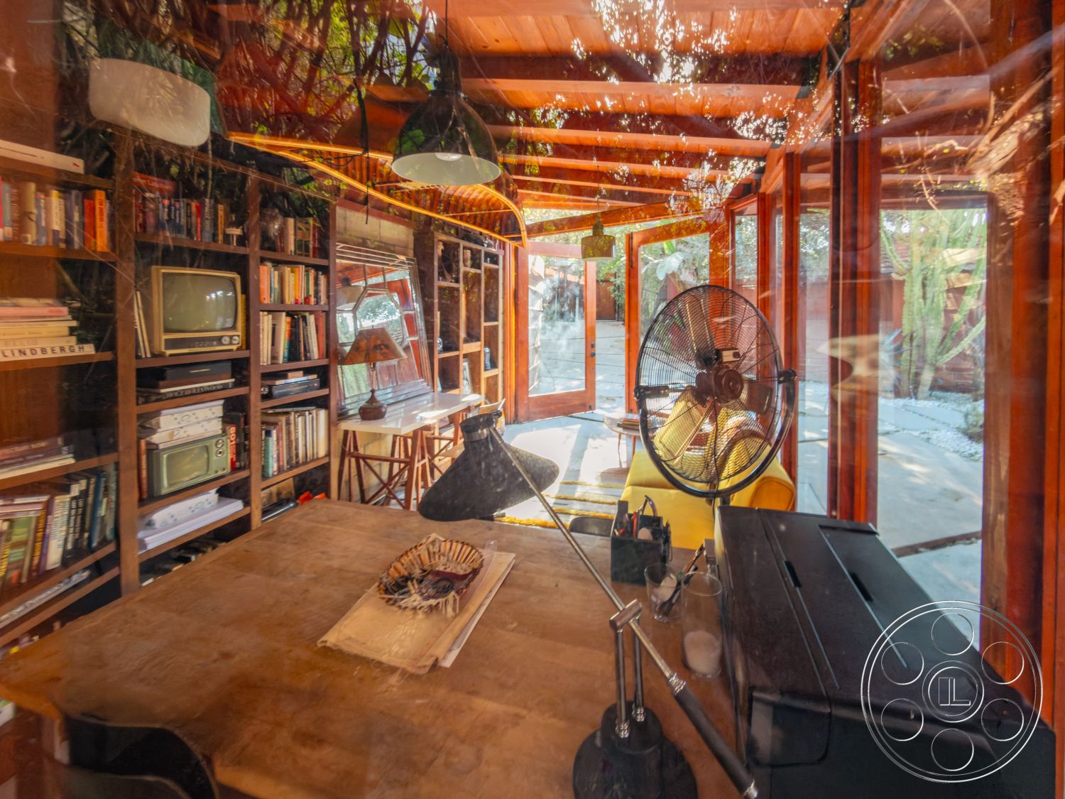 Pad 90210 - interior cozy reading nook, exterior landscaped garden view, exterior stone pathway, interior wood beam ceiling, exterior natural stone accents, interior industrial lighting fixtures, interior tile flooring, urban setting view, interior glass wall elements, interior reclaimed wood furniture, interior open shelving library, interior handcrafted wooden table, interior mid-century modern decor, interior vintage television display, interior potted plants decor, interior natural light influx, interior yellow accent furniture, interior smooth plaster wall finish, interior rustic design elements, interior contemporary artistic touches, exposed wooden framework, suburban style home