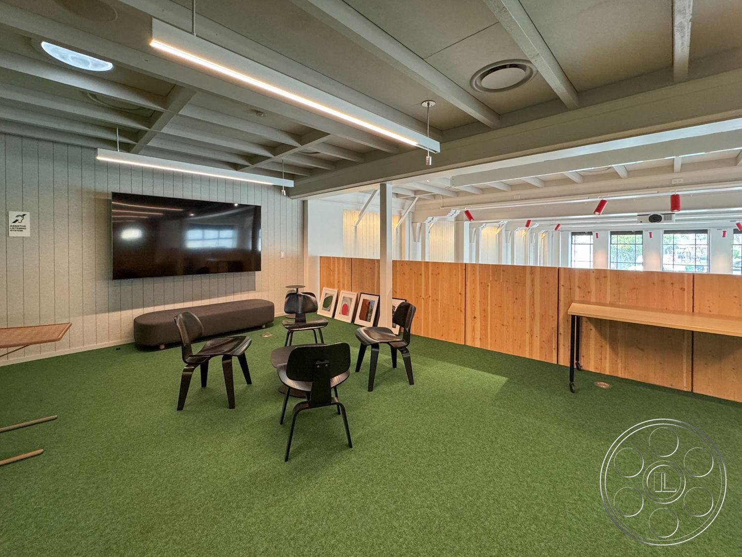 Studio 101 - neutral color palette, exposed beam ceiling, interior space, minimalist furniture, commercial interior design, natural light windows, flexible seating arrangement, open layout workspace, acoustic wall treatment, contemporary table design, accessible power outlets, multi-functional meeting area, carpet grass flooring, panelled wood wall, modern office seating, flat screen TV wall mounting, task lighting installation, retractable light fixtures, creative collaboration space, industrial ambiance