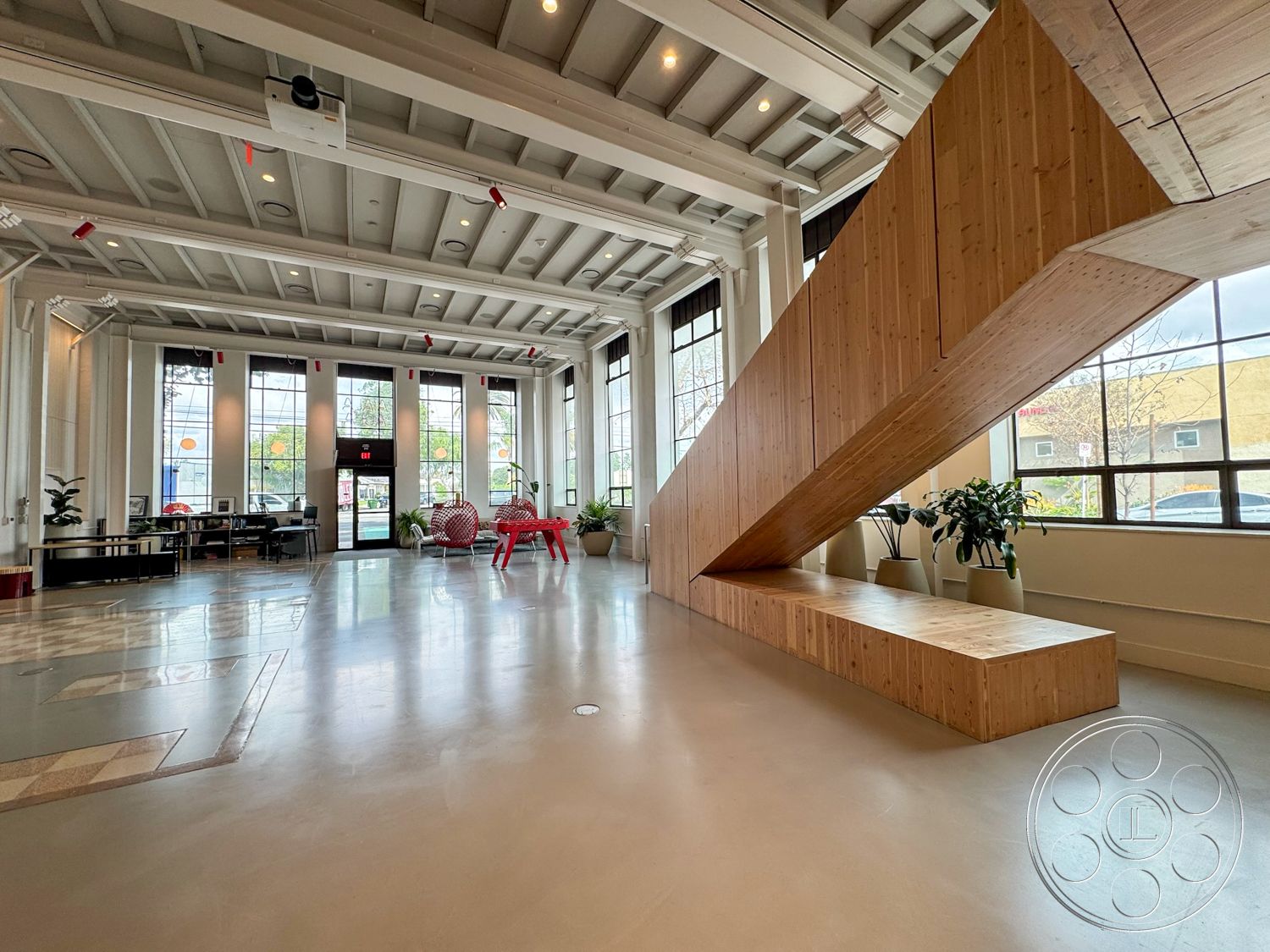 Studio 101 - contemporary furniture interior, exposed wood ceiling beams interior, natural light-filled space interior, open concept layout interior, large glass windows interior, urban setting interior, polished concrete floor interior, modern minimalist design interior, textured wall treatment interior, multi-functional space interior, wooden staircase structure interior, built-in wooden bench seating interior, green plant accents interior, sustainable materials interior