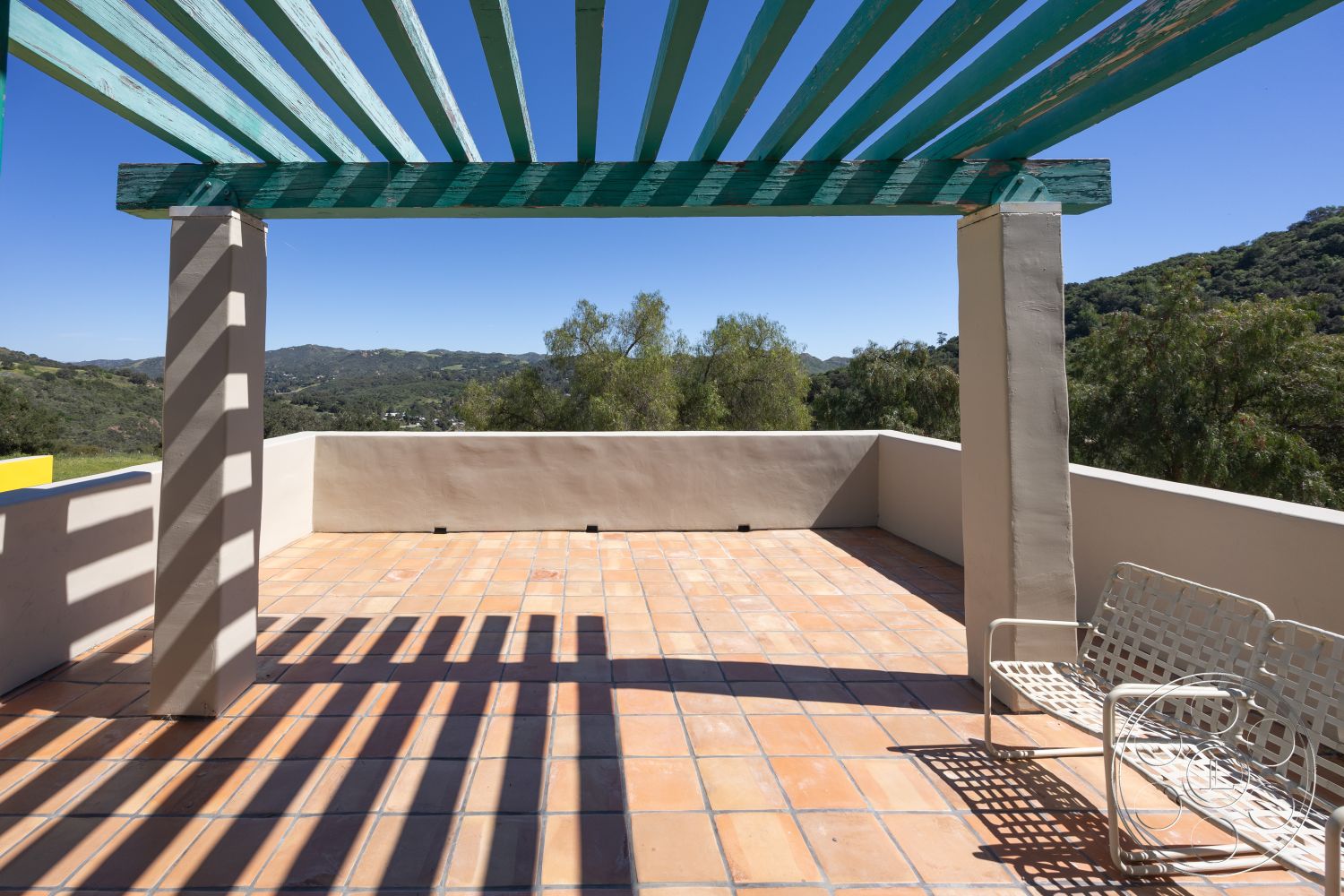 Casa del Rey - landscaped surroundings, concrete wall, open outdoor space, mountain view, rustic outdoor setting, minimalist outdoor furniture, exterior terrace, sun-drenched terrace, terracotta tile patio flooring, timber pergola with painted slats