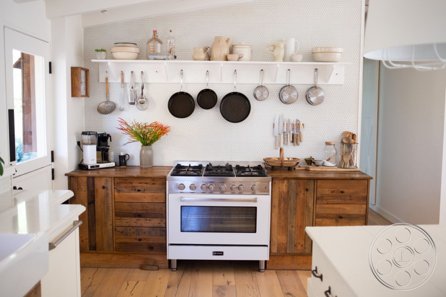 Ranch 33 - textured wall finish, natural light through windows, minimalist kitchen design, functional kitchen workspace, hardwood kitchen floors, bright interior lighting, open shelving kitchen, decorative flower arrangement, modern gas range, rustic wood cabinetry, white porcelain dishes, stainless steel cookware, ceramic kitchen utensils, neutral tile backsplash, farmhouse kitchen island, pantry storage solutions, wood countertop accents, hanging pot rack, industrial-style kitchen details