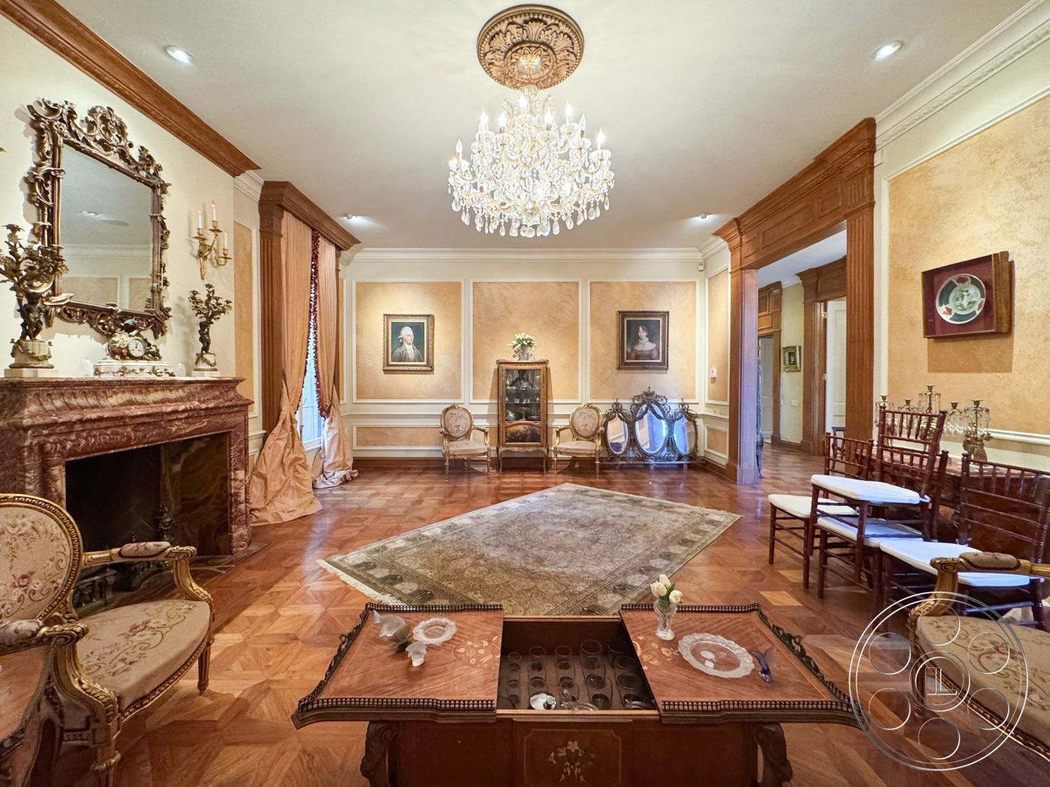 Mansion 146 - plush area rug, decorative wall sconces, grand entrance hall, decorative wall treatment, classic chandelier lighting, ornate crown molding details, vintage marble fireplace surround, stunning parquet wood flooring, gold-leafed framed mirrors, luxurious silk drapery, wood wainscoting accents, traditional seating area, framed portrait art, elegant side table design, polished brass candle holders, inviting living room layout, timeless antique furniture