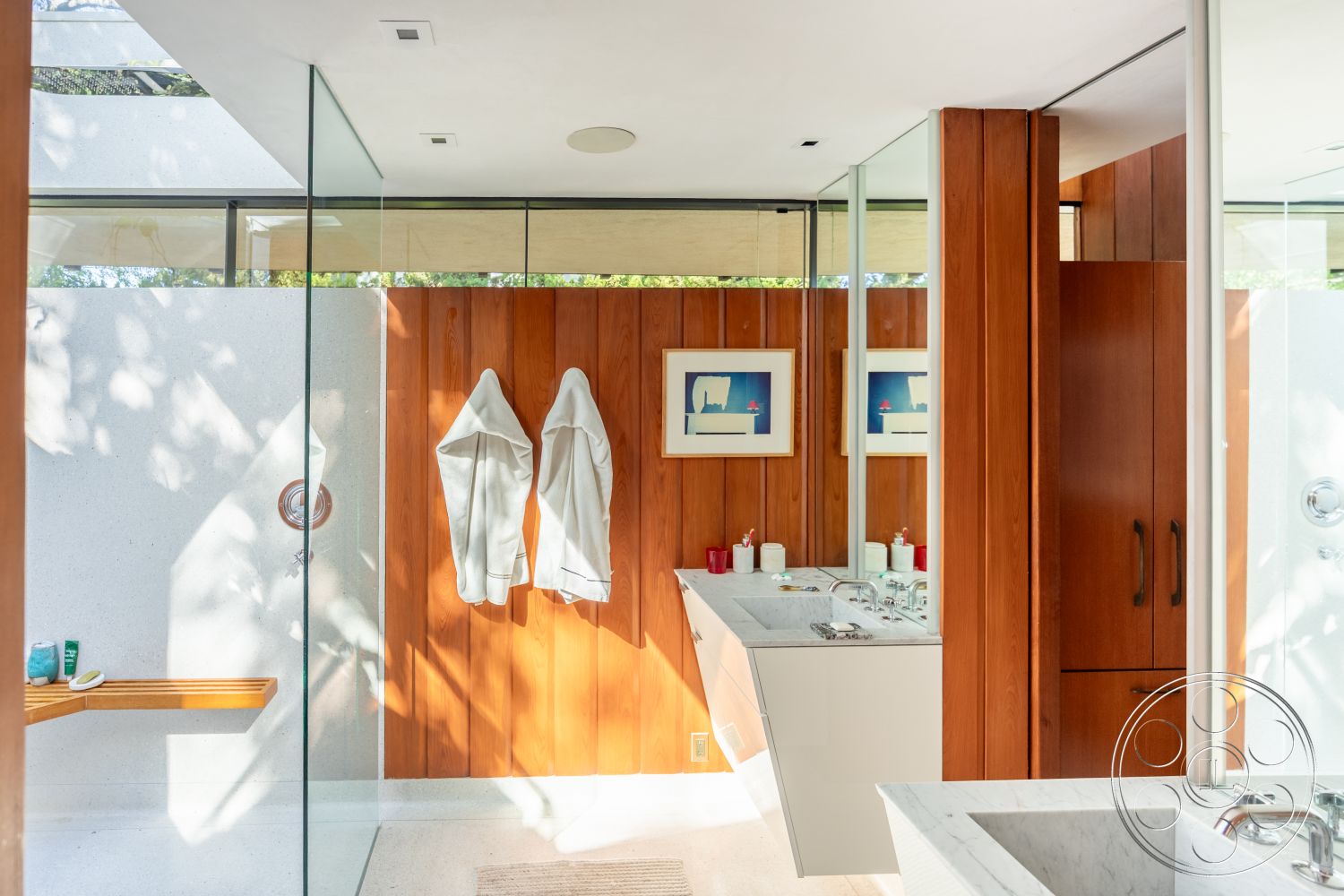 Silvertop House - interior recessed lighting, interior minimalistic design, interior soft natural lighting, interior glass shower enclosure, interior marble bathroom vanity, interior dual sink vanity, interior wood paneling accent wall, interior concrete bathroom flooring, interior floating wooden bench, interior polished stone wall, interior modern faucet fixtures, interior frosted glass windows, interior contemporary circular mirrors, interior white painted drywall, interior storage cabinets with wooden finishes, interior art decor wall frames, interior walk-in shower space