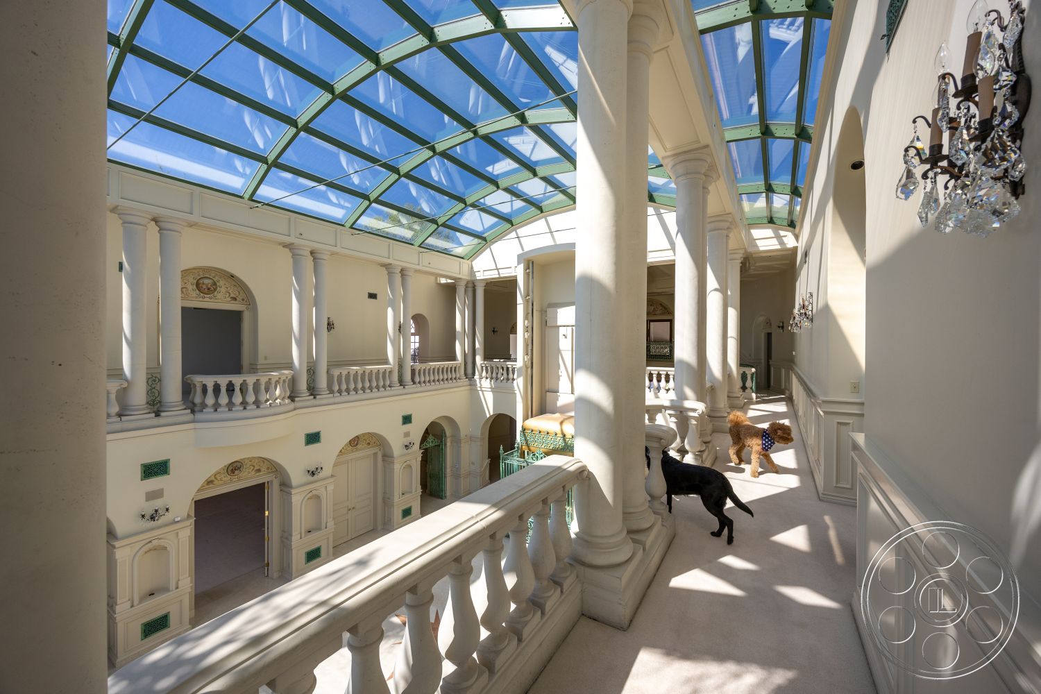 Pacifica Estate - interior vaulted ceiling, interior neutral color palette, interior open floor plan, interior built-in cabinetry, interior marble flooring, interior natural light flooding, interior arched doorways, interior luxury living area, interior crown molding details, interior historical architectural style, interior transitional space, interior crystal chandelier lighting, interior glass atrium roof, interior decorative plaster walls, interior ornate column details, interior balustrade railings, interior soft carpet flooring, interior grand entryway, interior elegant design elements, interior pet-friendly space