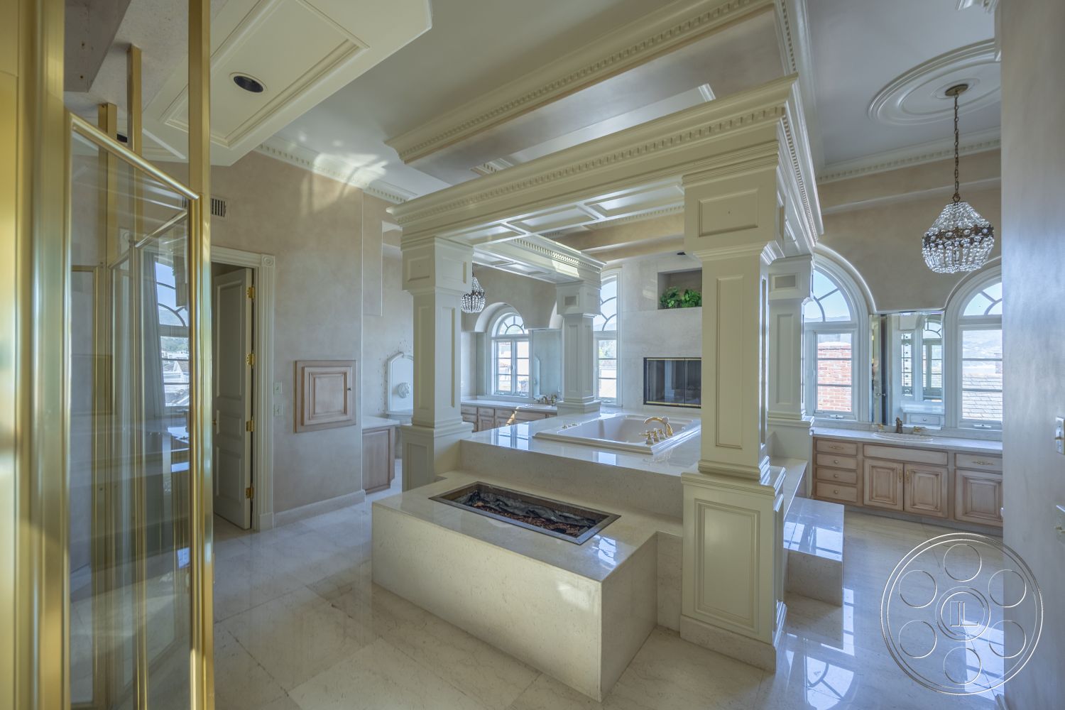 Pacifica Estate - custom cabinetry, floor-to-ceiling windows, high-end finishes, chrome fixtures, textured wall finishes, elegant chandelier, arched windows, plush seating area, exposed wood ceiling beams, open floor plan layout, white painted walls, coffered ceiling details, marble bathroom flooring, natural light abundance, built-in vanities, gold-framed glass shower doors, luxurious soaking tub, subtle pastel color palette, modern luxury aesthetic