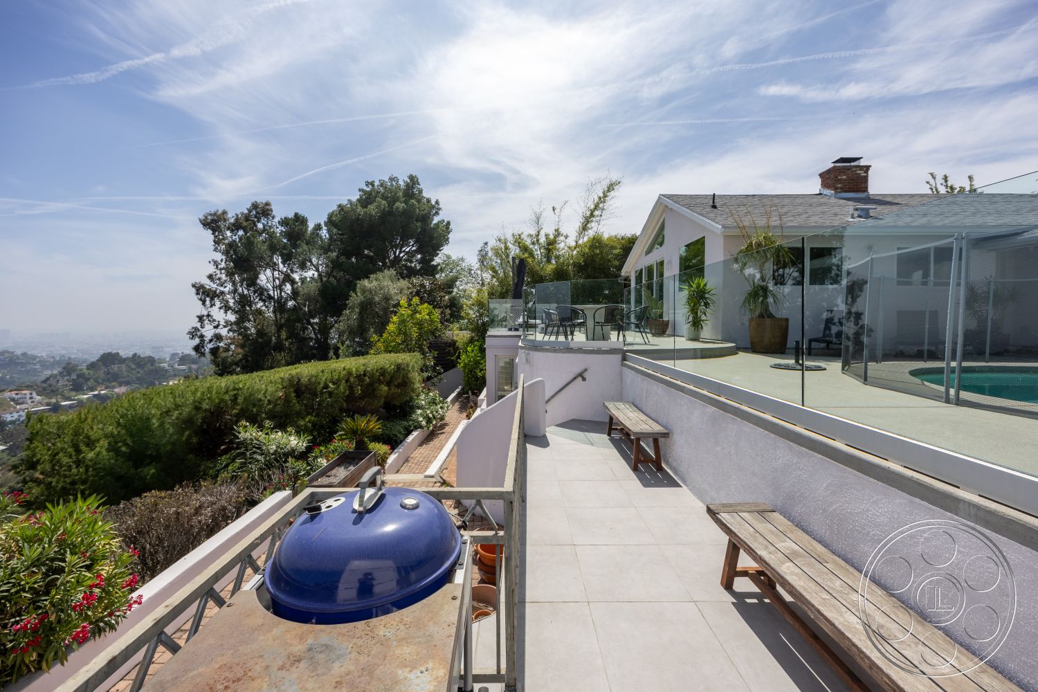 Retro 288 - exterior, modern architecture, potted plants, rectangular swimming pool, stone barbecue area, glass pool fence, wooden benches, flat roof design, mountain view setting, concrete patio flooring, landscaped garden with shrubs, open sky visibility, tile outdoor terrace