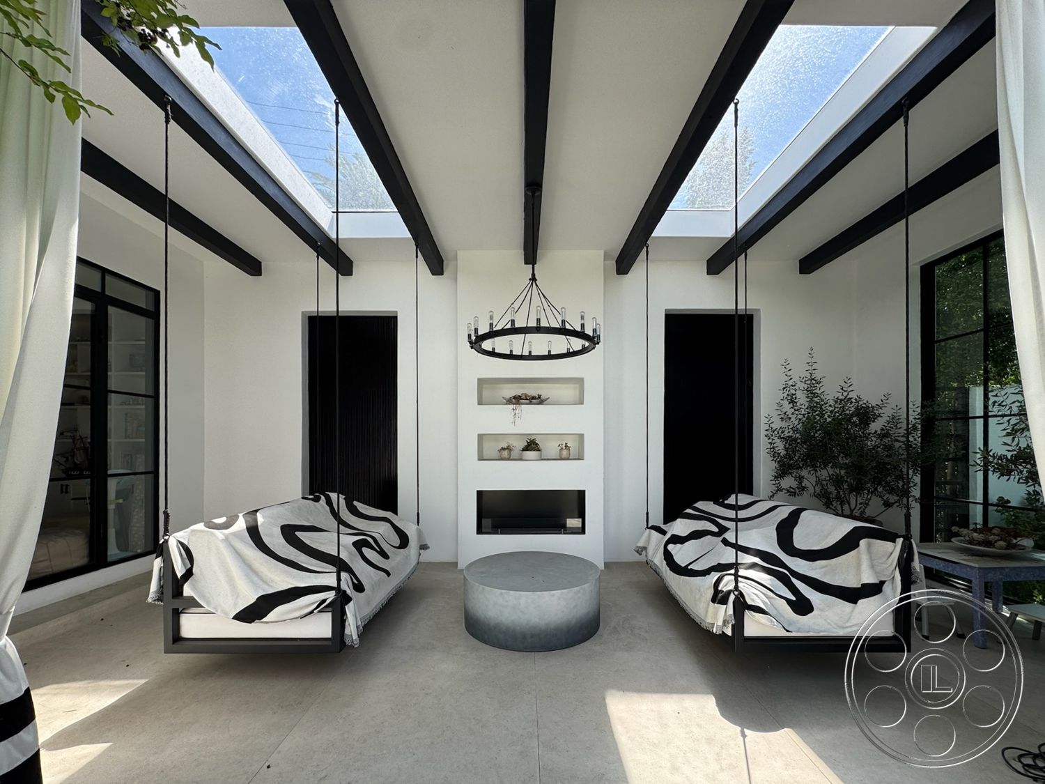 Modern 522 - natural light, contemporary style, exterior, minimalist design, indoor plants, large glass windows, open-air space, black accent wall, chandelier light fixture, vertical wood paneling, built-in shelving units, concrete floor tiles, suspended swing beds, black metal bed frames, white textured bed linens, black wooden ceiling beams