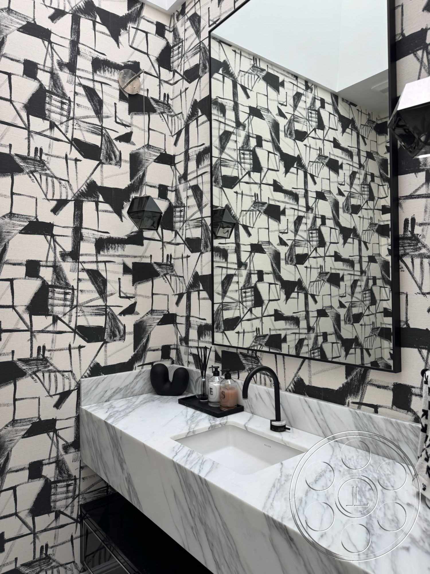 Modern 522 - dark cabinetry, rectangular mirror, modern faucet design, marble bathroom countertop, minimalist bathroom accessories, textured wallpaper with abstract black and white pattern, black decorative wall sconces