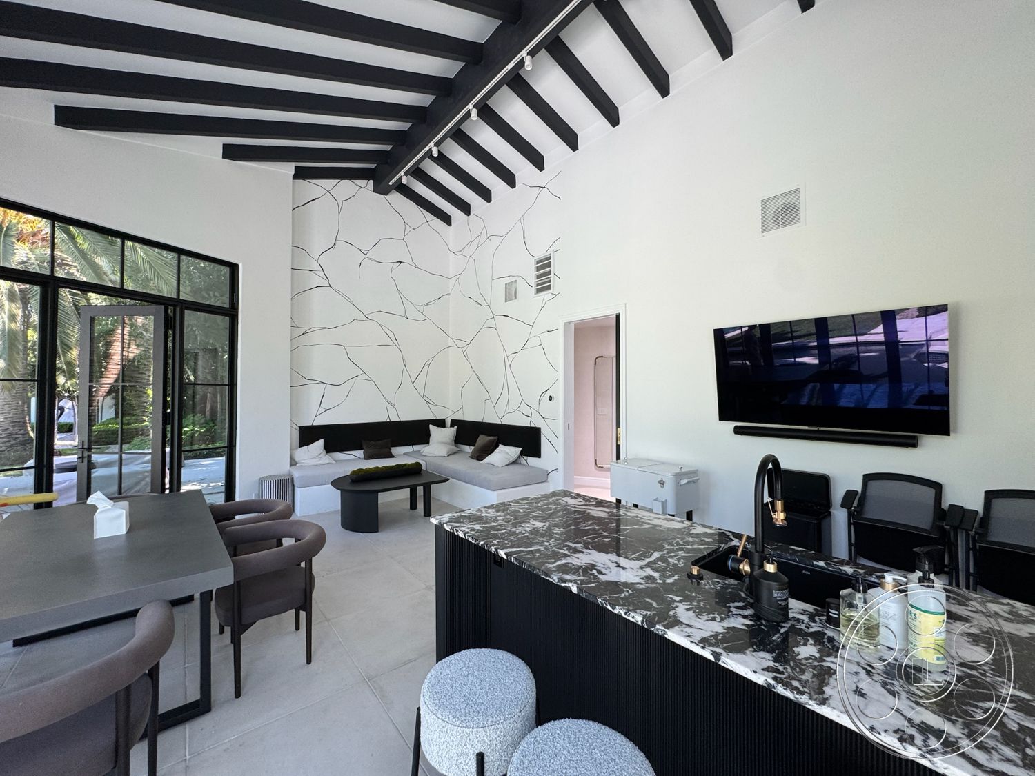 Modern 522 - contemporary style, minimalist design, black accent table, open floor plan, floor-to-ceiling windows, black dining chairs, modern dining table, black wood beam ceiling, textured plaster wall, marble kitchen countertop, white painted walls, concrete floor tiles, modern flat-screen TV, built-in sofa seating