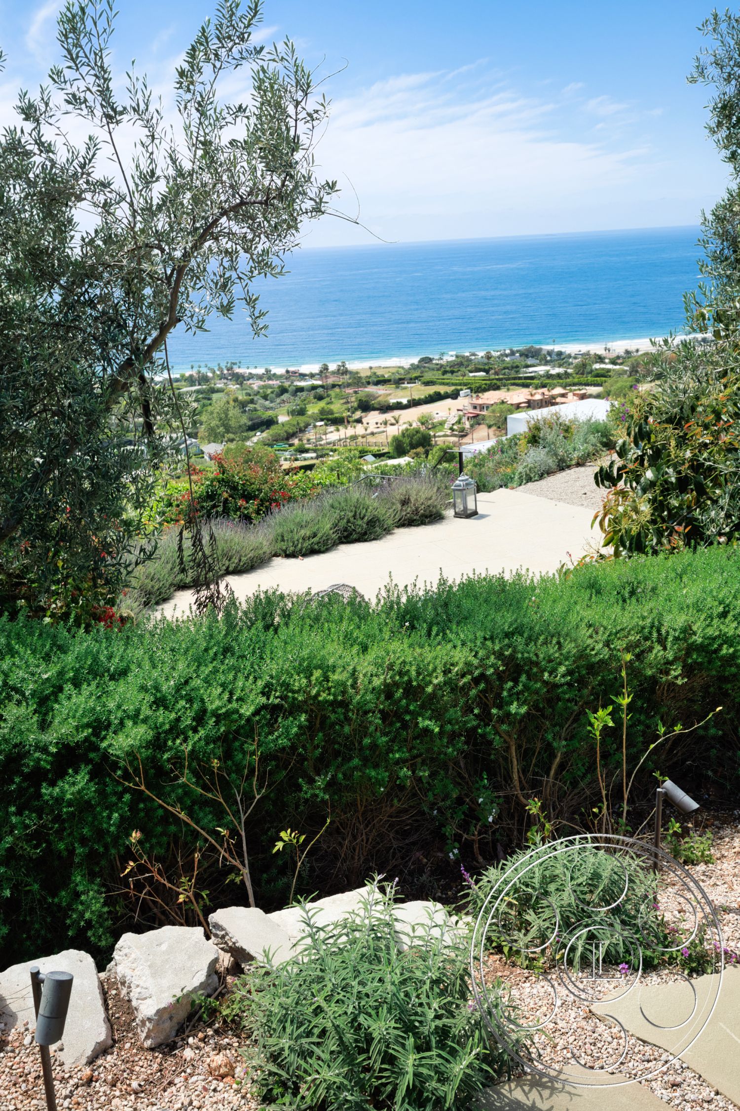 Modern 523 - exterior, green foliage, ocean view, flowering plants, tropical atmosphere, desert environment, stone garden path, landscaped garden with hedges, gravel ground surface, beachside location, stone accents in landscaping