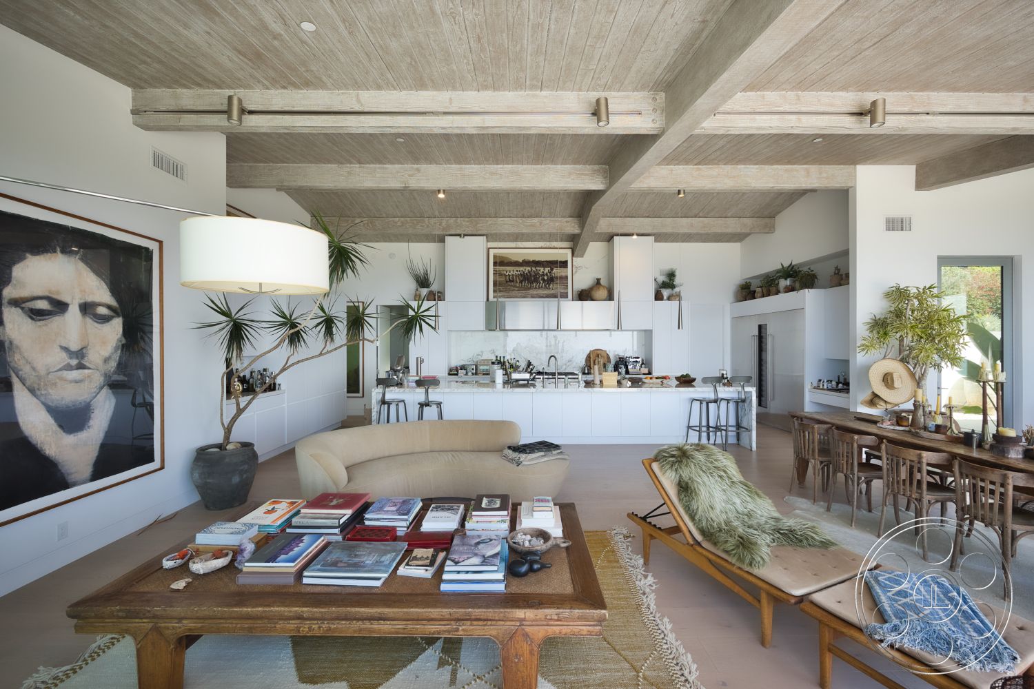 Modern 523 - minimalist decor, neutral color palette, natural lighting, wood coffee table, indoor plants, textured area rug, stainless steel appliances, wood dining table, floor-to-ceiling windows, white cabinetry, decorative shelving, concrete ceiling, large artwork on wall, smooth concrete floor, wooden dining chairs, exposed wood ceiling beams, open kitchen layout, earth-toned sofa
