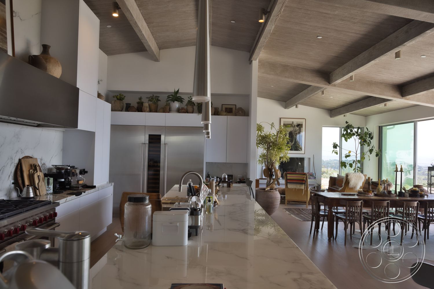 Modern 523 - natural light, hardwood flooring, minimalist design, stone accent wall, contemporary furniture, open floor plan, stainless steel appliances, floor-to-ceiling windows, plants as decor, vaulted ceiling, chef's kitchen, modern dining area, marble kitchen countertops, concrete ceiling beams, white cabinetry kitchen
