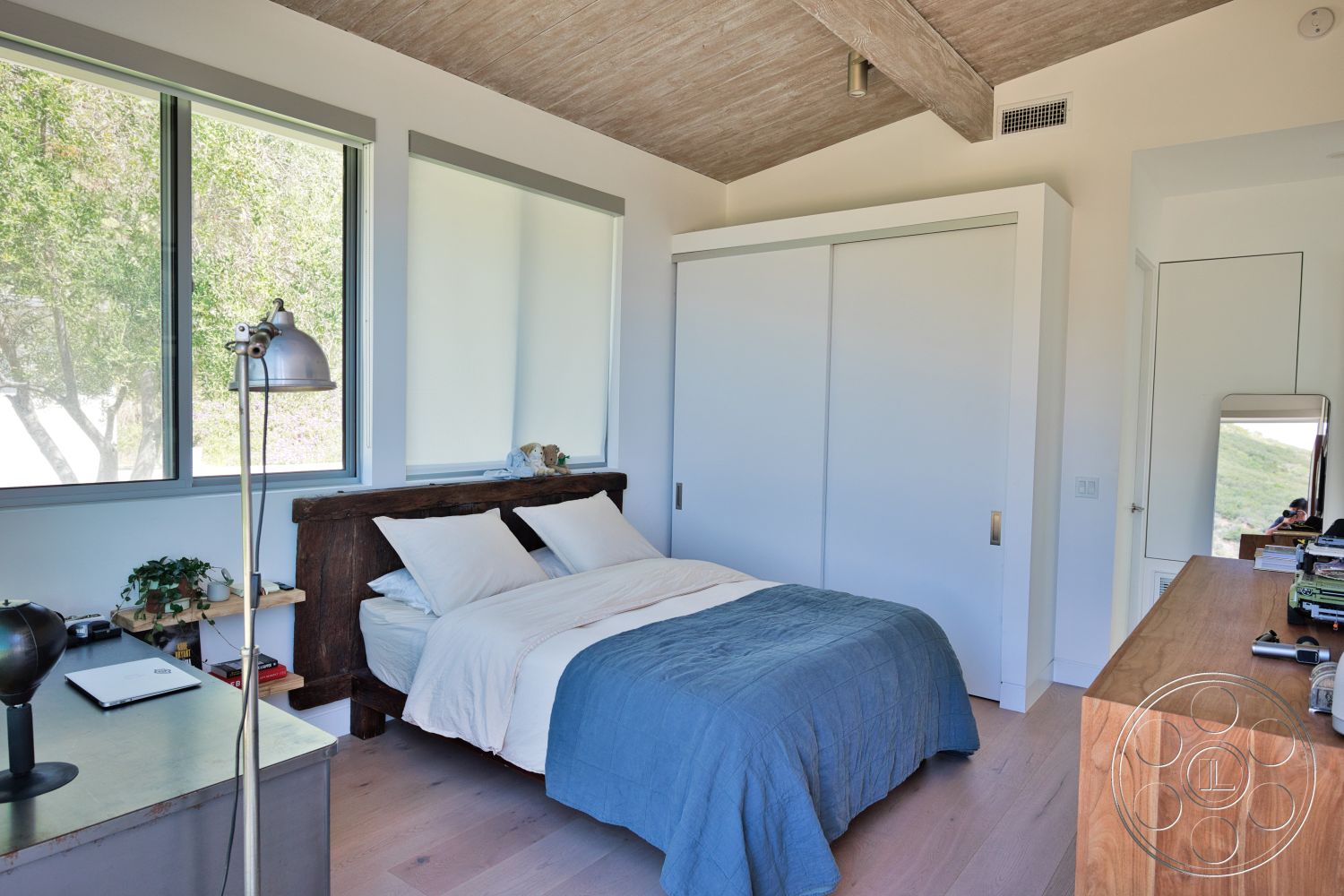 Modern 523 - natural light, exterior, large rectangular windows, wood beam ceiling, white painted walls, modern minimalist furniture, contemporary bedroom, light hardwood bedroom floors, solid wood bed frame, built-in sliding closet doors