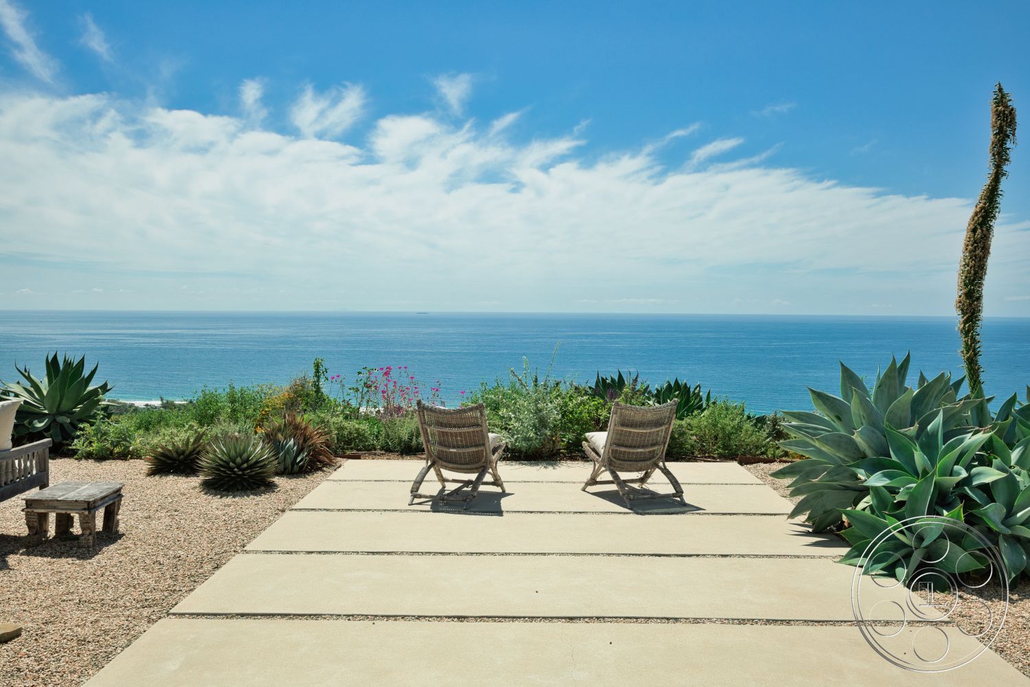Modern 523 - exterior, landscaped garden, wooden bench seating, coastal view, sea view, concrete patio flooring, rectangular patio, textured gravel ground, native plants landscape, desert-style plants, comfortable outdoor chairs