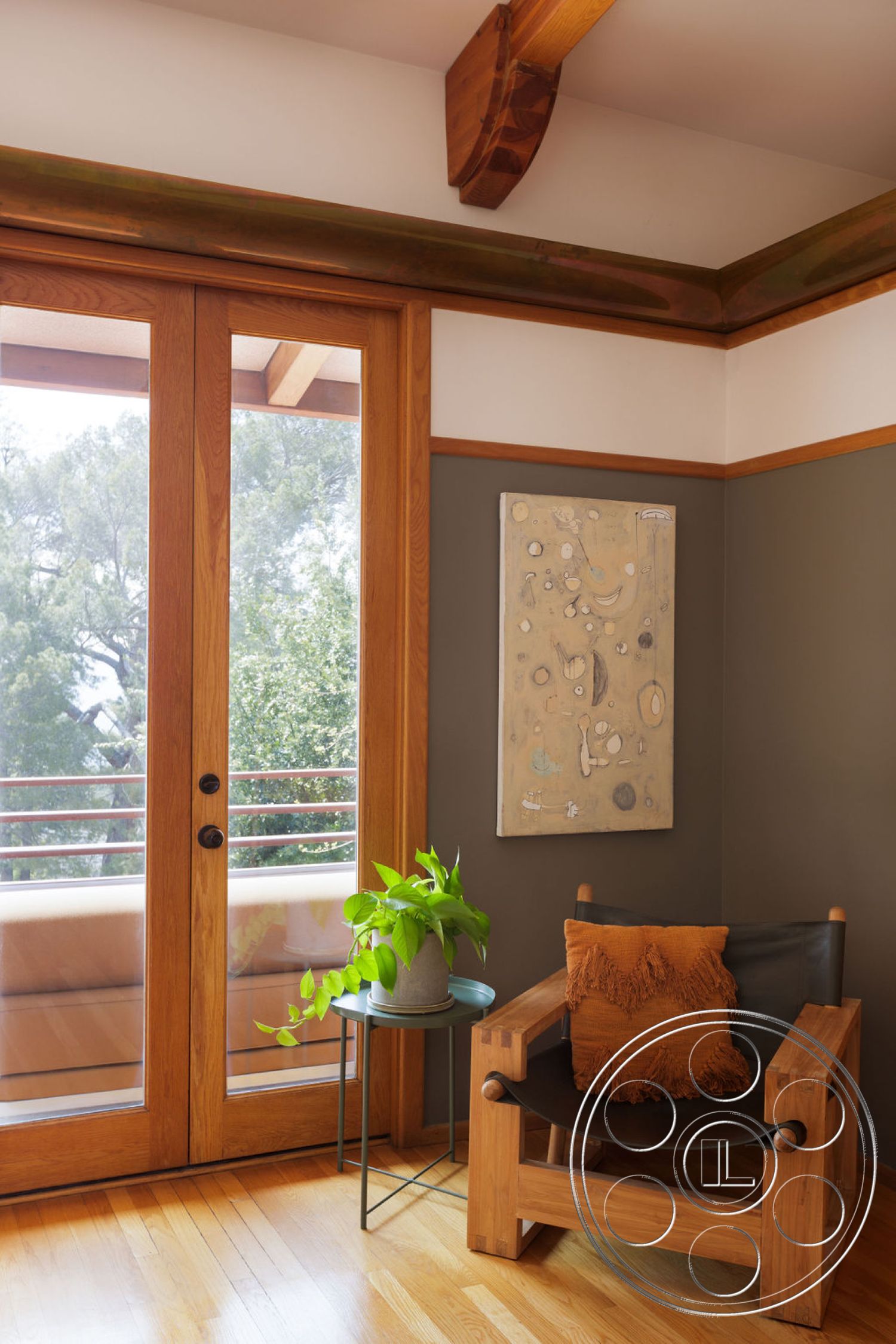 Mid-Century Exotic - hardwood floor, orange accent pillow, exposed wood ceiling beams, potted indoor plant, wood framed glass doors, earthy green wall treatment, textured art wall decor, modern living room seating, circular metal side table