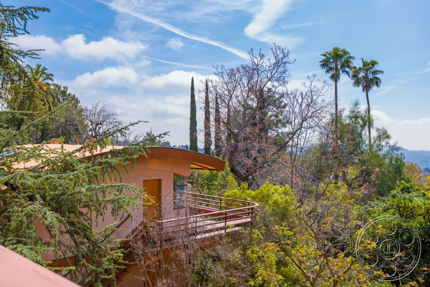 Mid-Century Exotic - exterior, surrounding greenery, contemporary architecture, mountain view, textured plaster walls, tropical palm trees, curved roofline, wooden balcony railing