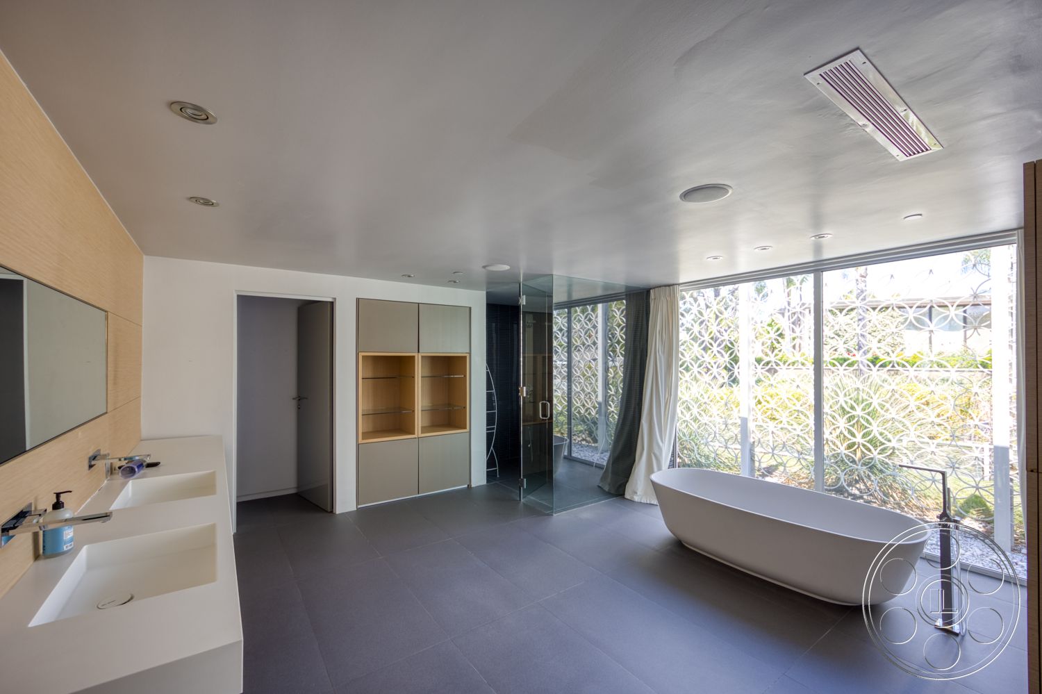 Modern 525 - neutral color palette, minimalist design, glass shower enclosure, double sink vanity, floor-to-ceiling windows, tile bathroom flooring, smooth plaster ceiling, light wood vanity cabinet, floating bathtub, mirrored wall above vanity, decorative window screen