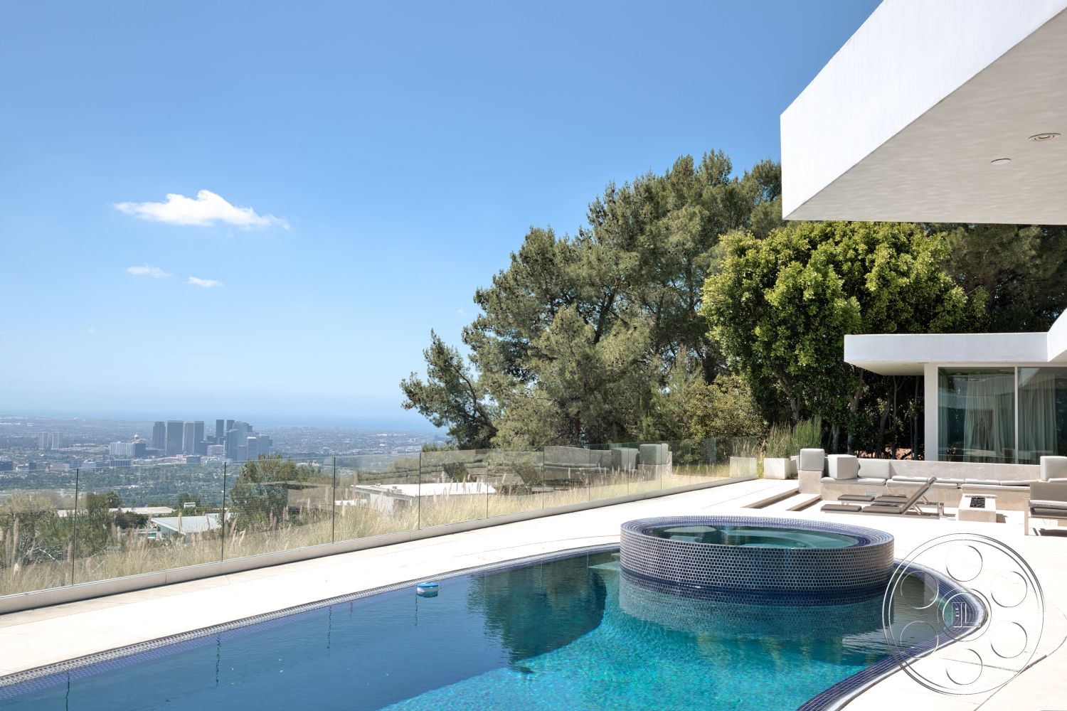 Modern 525 - floor-to-ceiling windows, contemporary architecture, city skyline view, infinity pool, rectangular pool, hillside location, stone patio flooring, concrete pool border, glass pool fencing