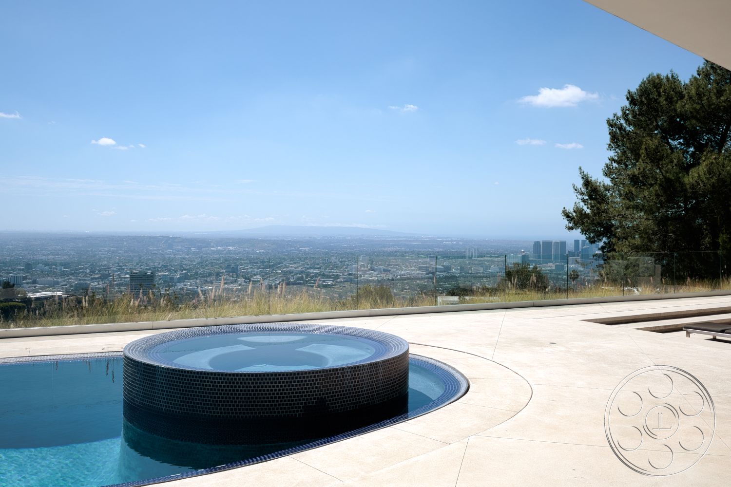Modern 525 - exterior, modern architecture, glass railing, smooth concrete flooring, mountain view, infinity pool, concrete pool deck, open landscape, tile pool border, round hot tub