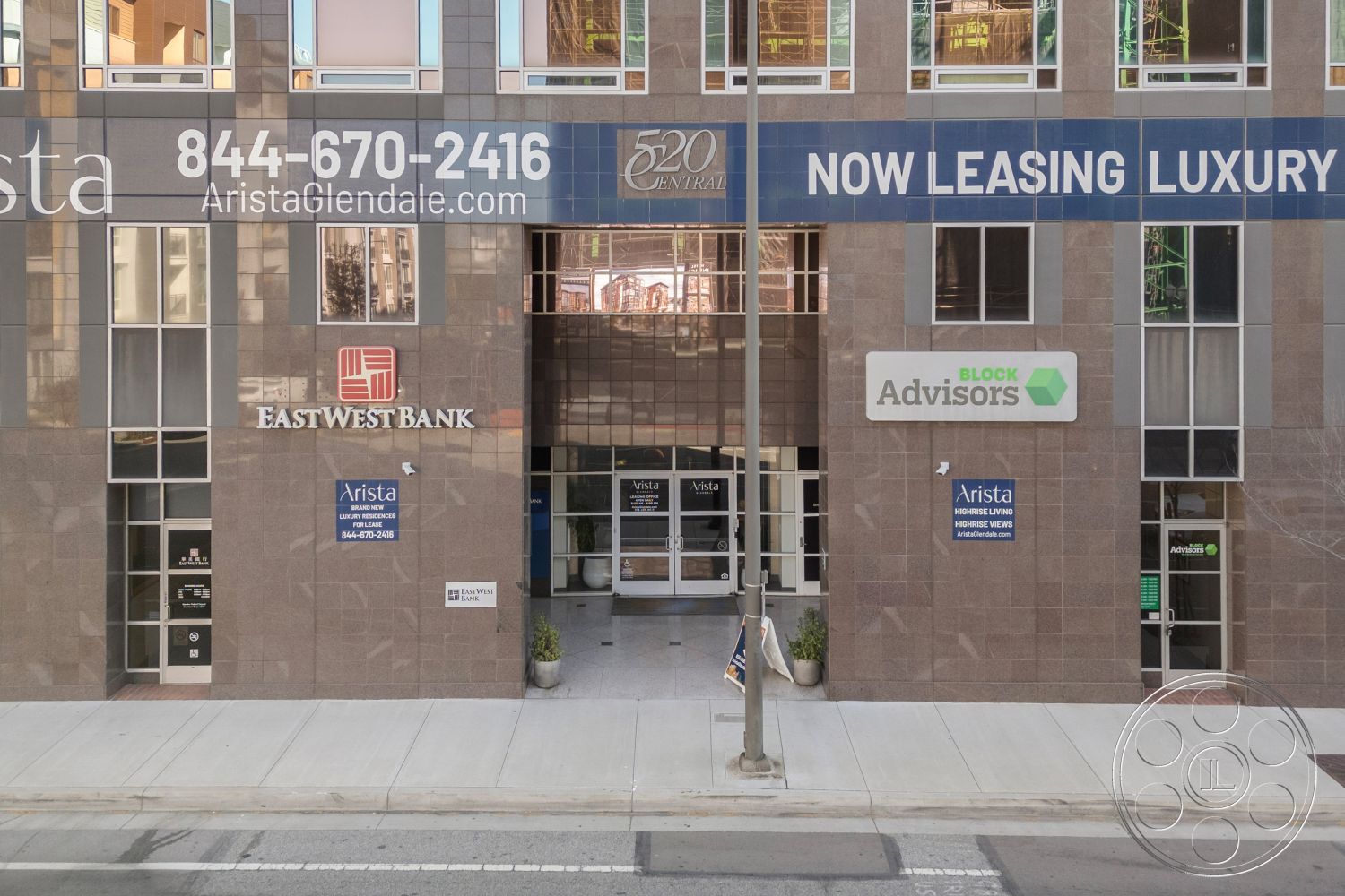 Rooftop-52 - exterior, landscaped planters, paved sidewalk, rectangular windows, urban city environment, modern commercial building, commercial storefront, glass window façade, granite building cladding, signage with bold typography, metallic signage, façade with linear design elements