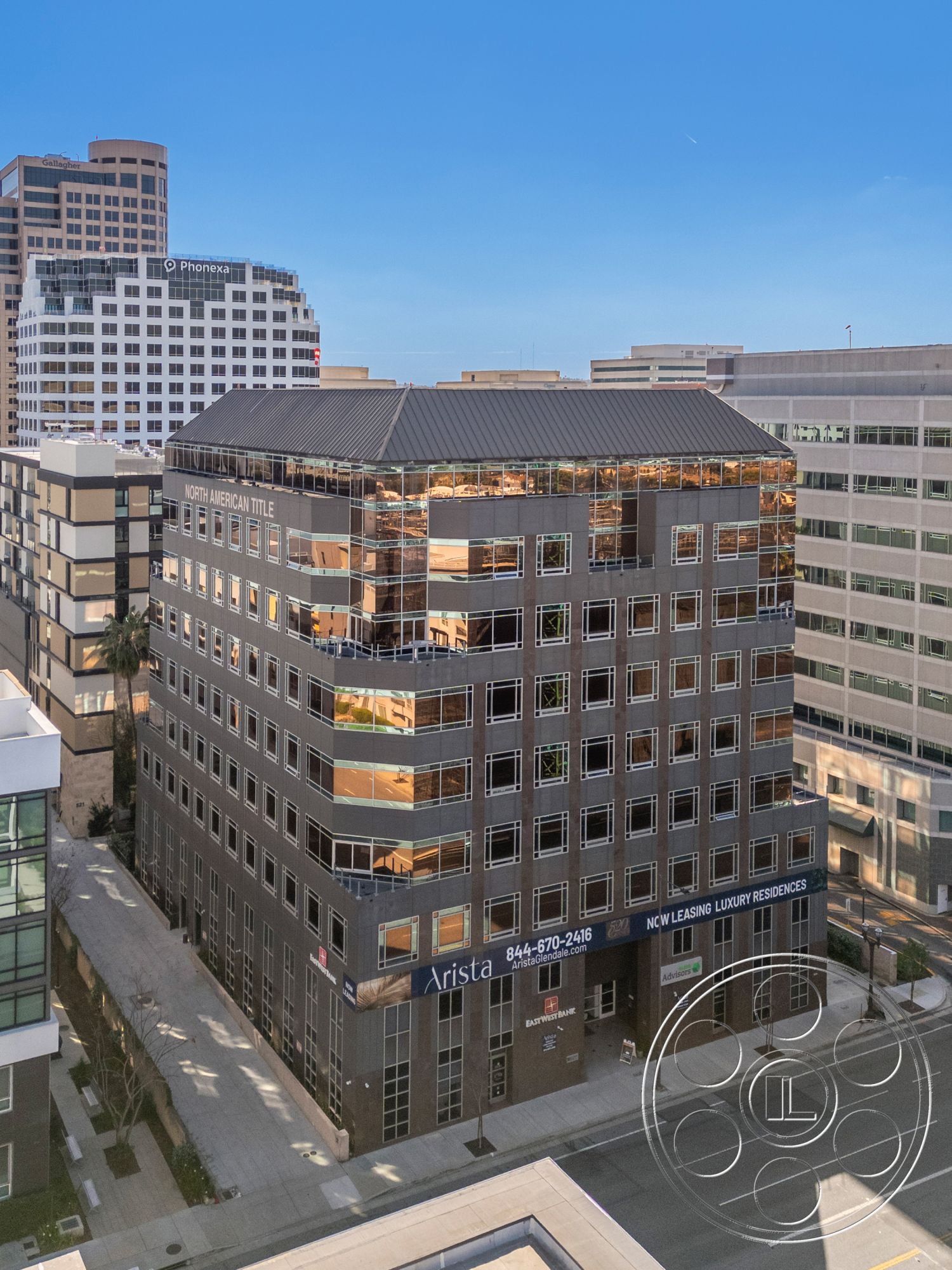 Rooftop-52 - exterior, flat roof, urban setting, modern architectural style, business district location, rectangular building shape, concrete building facade, glass window panels, multi-story structure, steel frame windows, mixed-use commercial building