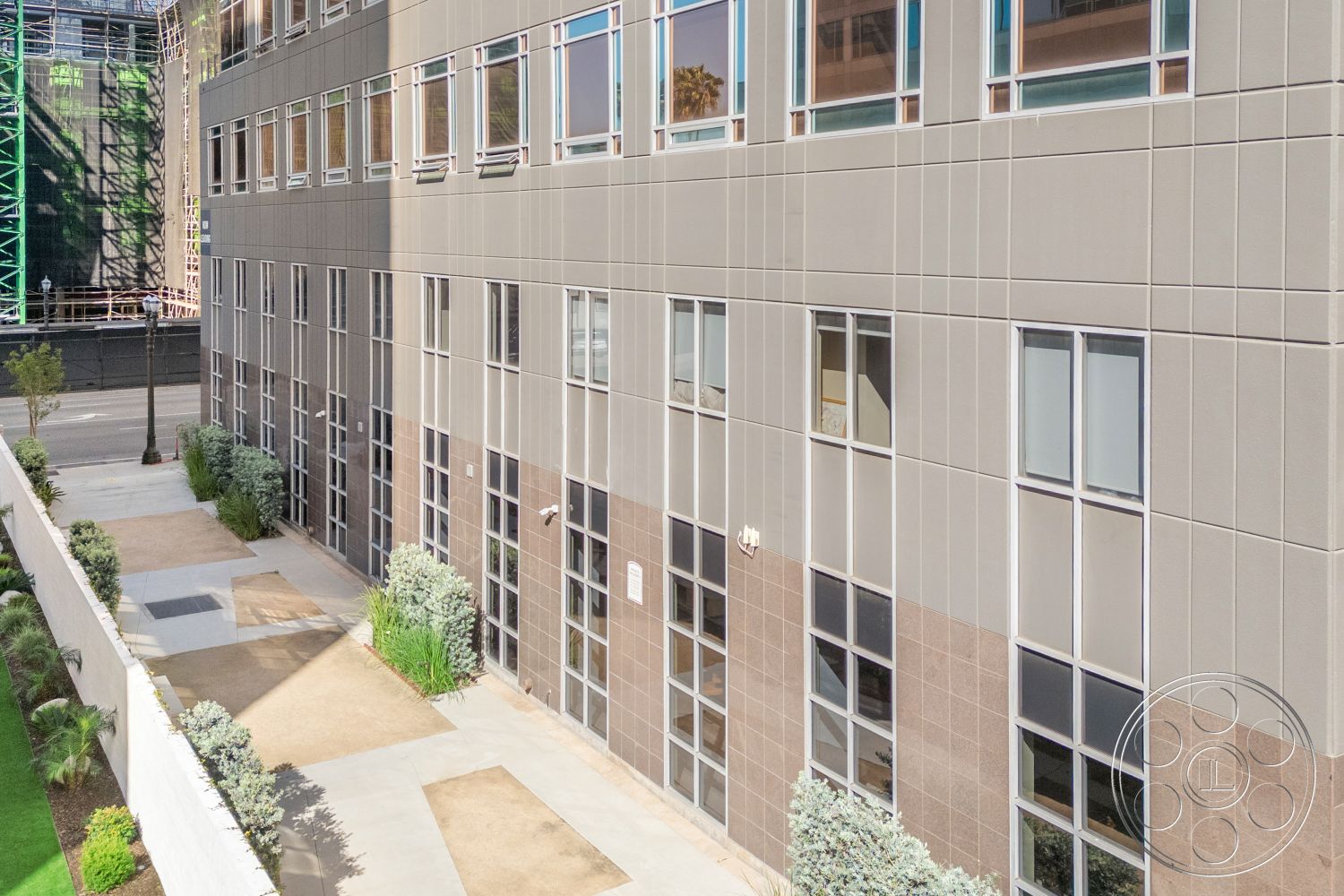 Rooftop-52 - exterior, planter beds, modern architecture, urban setting, glass windows, landscaped courtyard, commercial building, textured wall surfaces, paved walkway, concrete wall panels, brown stone facade