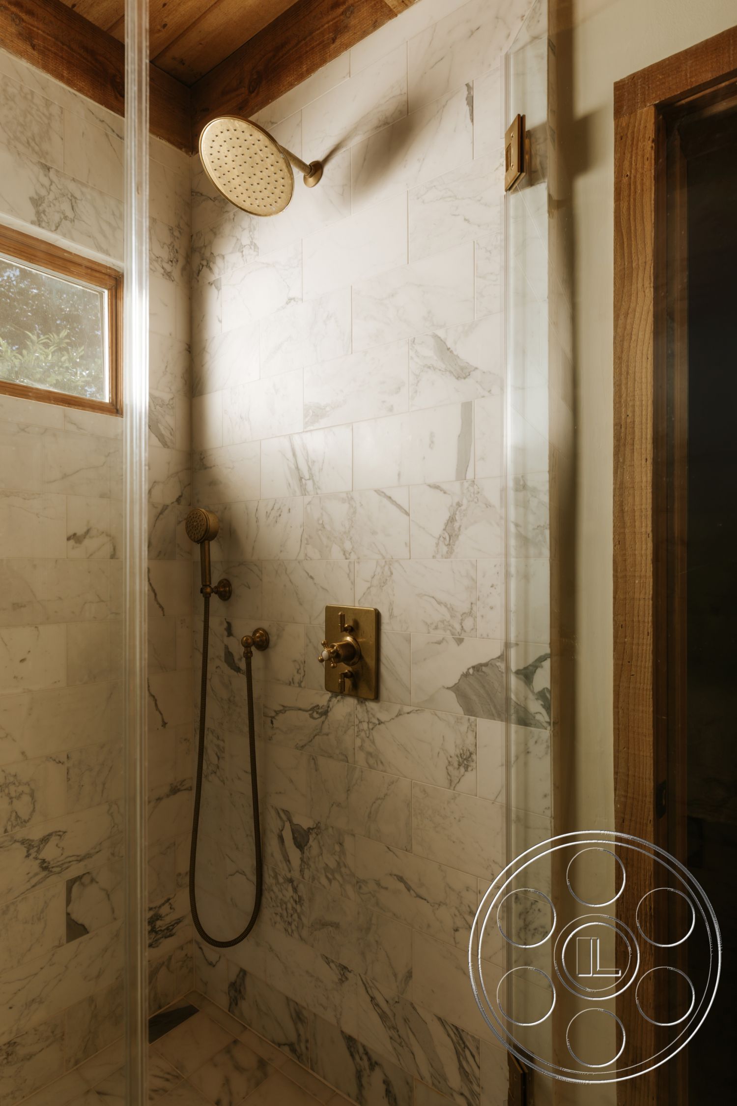 Modern-Farmhouse 20 - glass shower enclosure, wood beam ceiling, modern showerhead, marble shower walls, bronze shower fixtures, marble shower floor