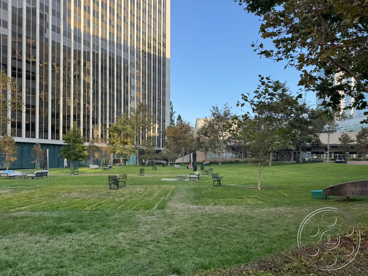 Ave Of The Stars - exterior, planted trees, metal benches, concrete base, urban park setting, paved walking paths, landscaped green lawn, glass building facade, tall office building