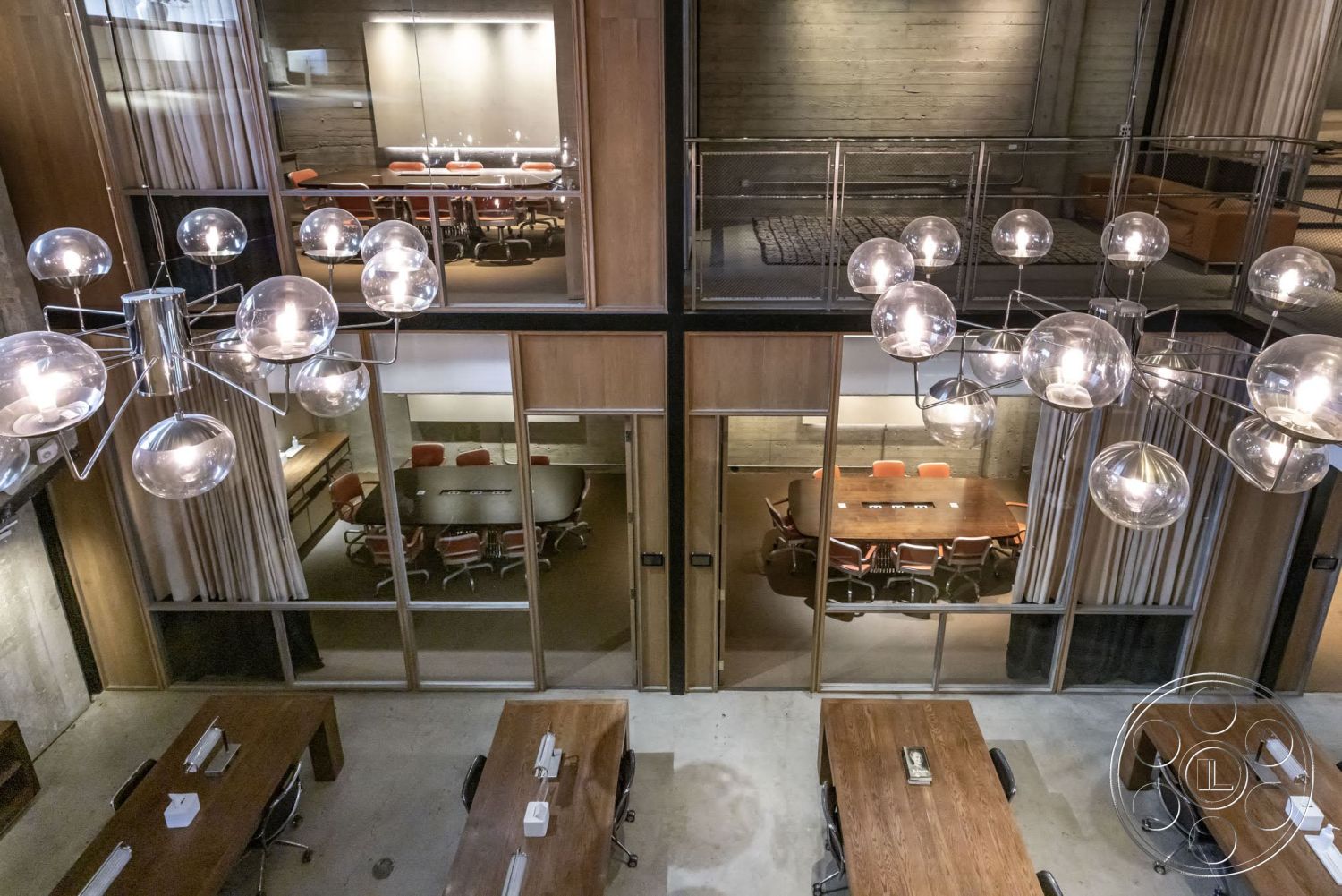Sunset Campus - concrete flooring, modern pendant lighting, exposed concrete walls, industrial design, steel railing, overhead lighting fixtures, glass partition walls, open-plan workspace, hardwood conference table, textured curtain panels, meeting room, brightly lit conference room
