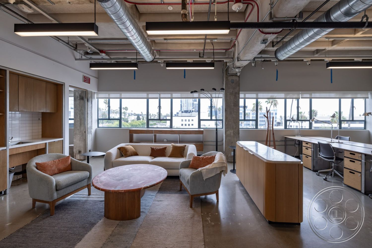 Sunset Campus - large windows, exterior, contemporary furniture, open layout, round table, wood cabinetry, industrial style, concrete floors, urban view, exposed concrete ceiling, metal ductwork, accent pillows, soft upholstery, modern office space