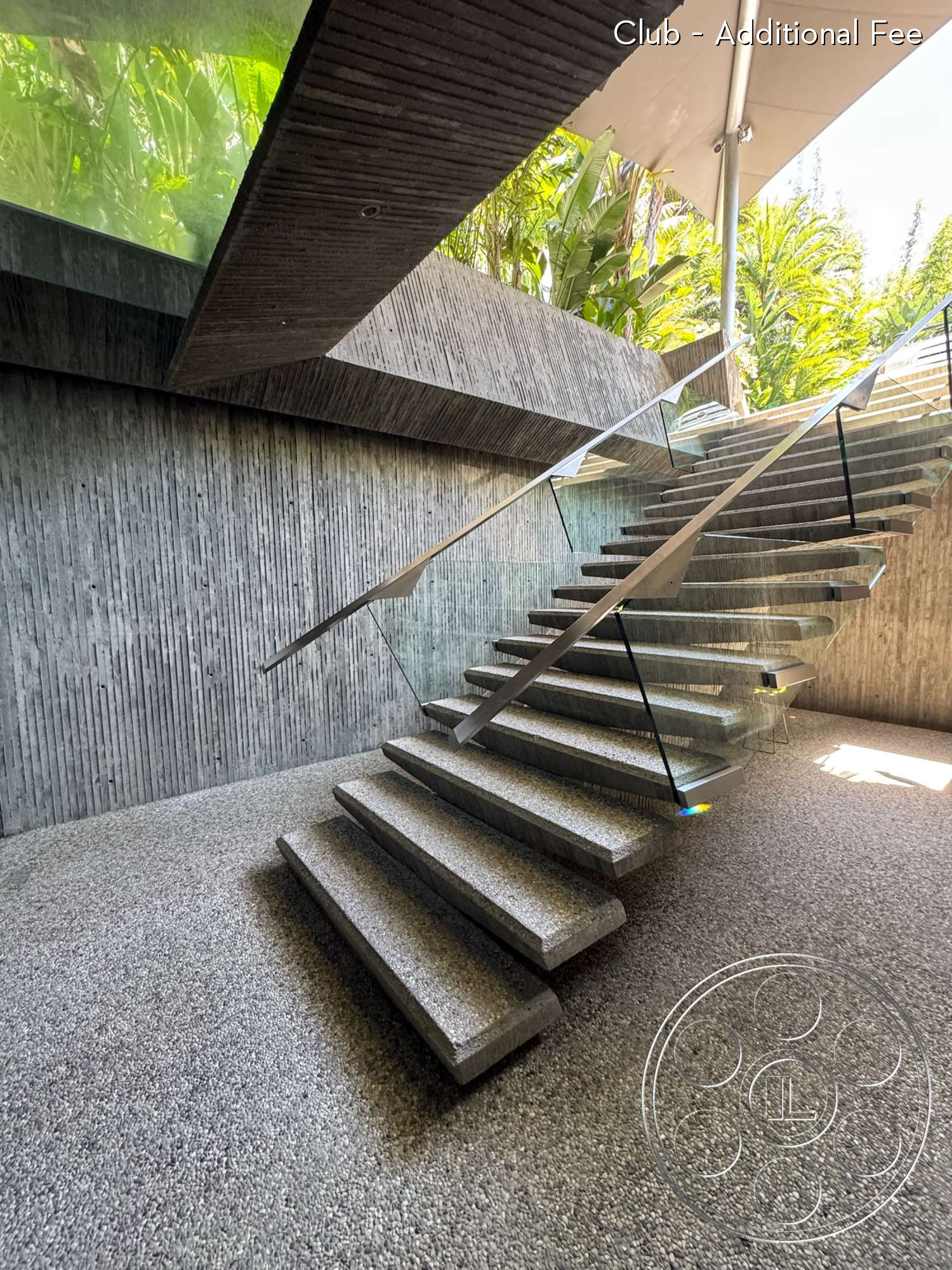 Goldstein House - glass railing, open staircase, minimalist aesthetic, modern architectural design, textured concrete wall, polished concrete steps, landscaped greenery view, exterior stairs, gray aggregate flooring