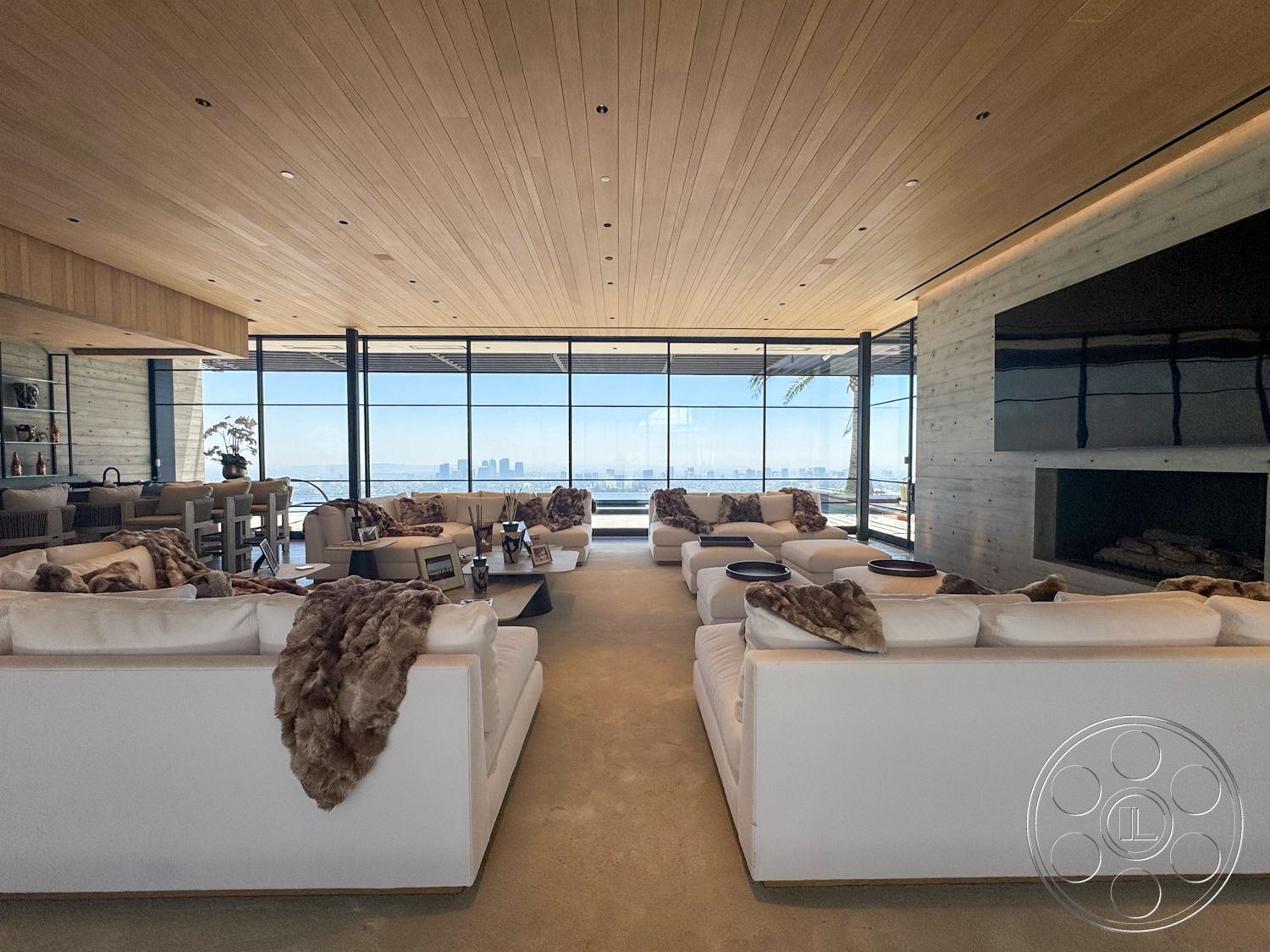 Star Villa - minimalist decor, natural light, open floor plan, concrete floor, concrete walls, luxury living room, view of city skyline, stone fireplace wall, glass floor-to-ceiling windows, wood plank ceiling, modern sectional sofas