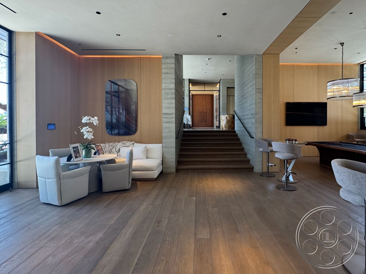 Star Villa - neutral color palette, hardwood flooring, open floor plan, modern pendant lighting, floor-to-ceiling windows, textured wall paneling, contemporary dining area, wooden front door, built-in cabinetry, exposed wood ceiling beams, concrete accent walls, stainless steel stair railing