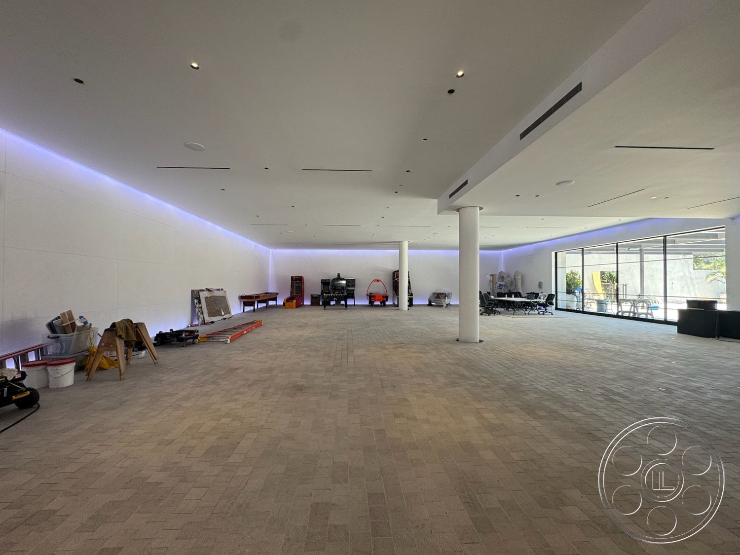 Star Villa - open floor plan, interior space, floor-to-ceiling windows, modern architectural style, textured plaster walls, ambient LED lighting, light-colored smooth ceilings, paver stone flooring, structural support columns