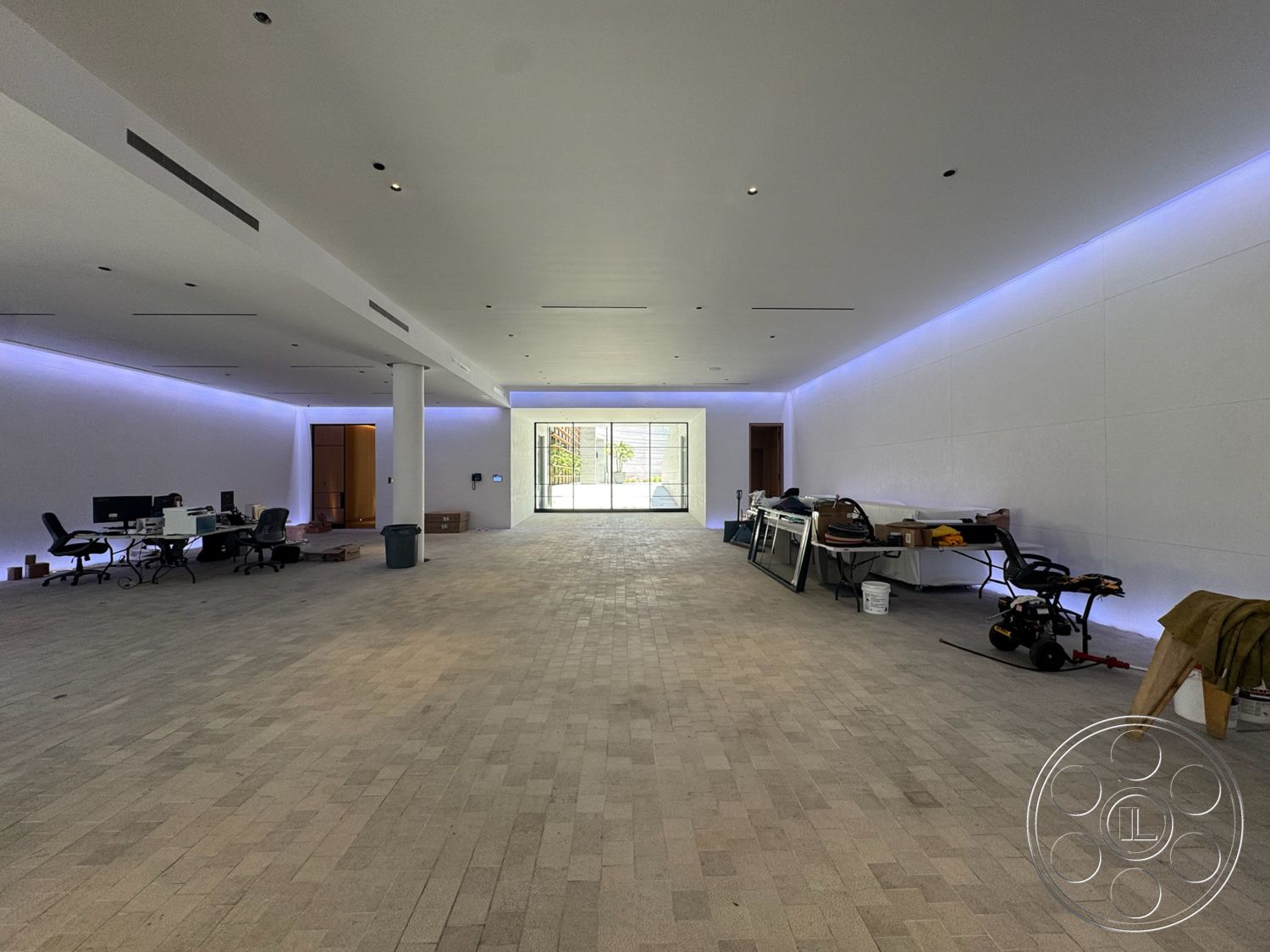 Star Villa - minimalist design, floor-to-ceiling windows, textured plaster walls, contemporary architectural style, recessed ceiling lighting, open layout space, exposed ceiling details, paver stone flooring, focal glass sliding door, wall-mounted LED strip lighting