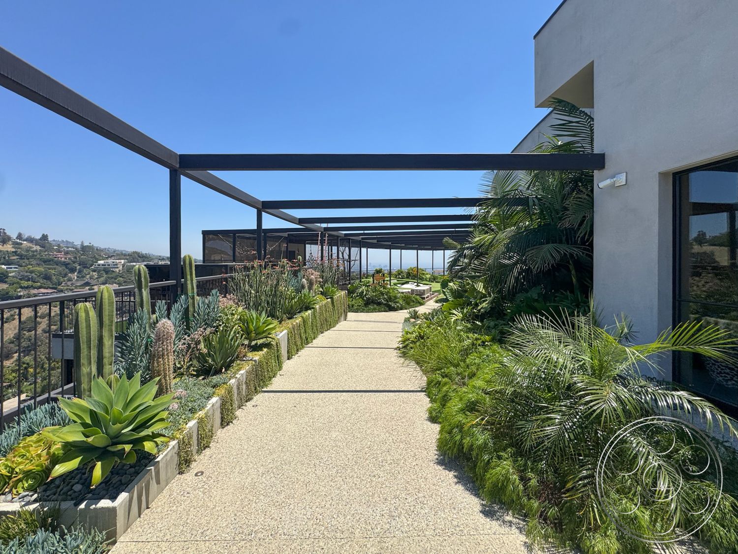 Star Villa - exterior, gravel landscaping, view of hillside, contemporary architectural details, greenery accent plants, modern outdoor setting, metal pergola structure, succulent garden bed, textured concrete pathway