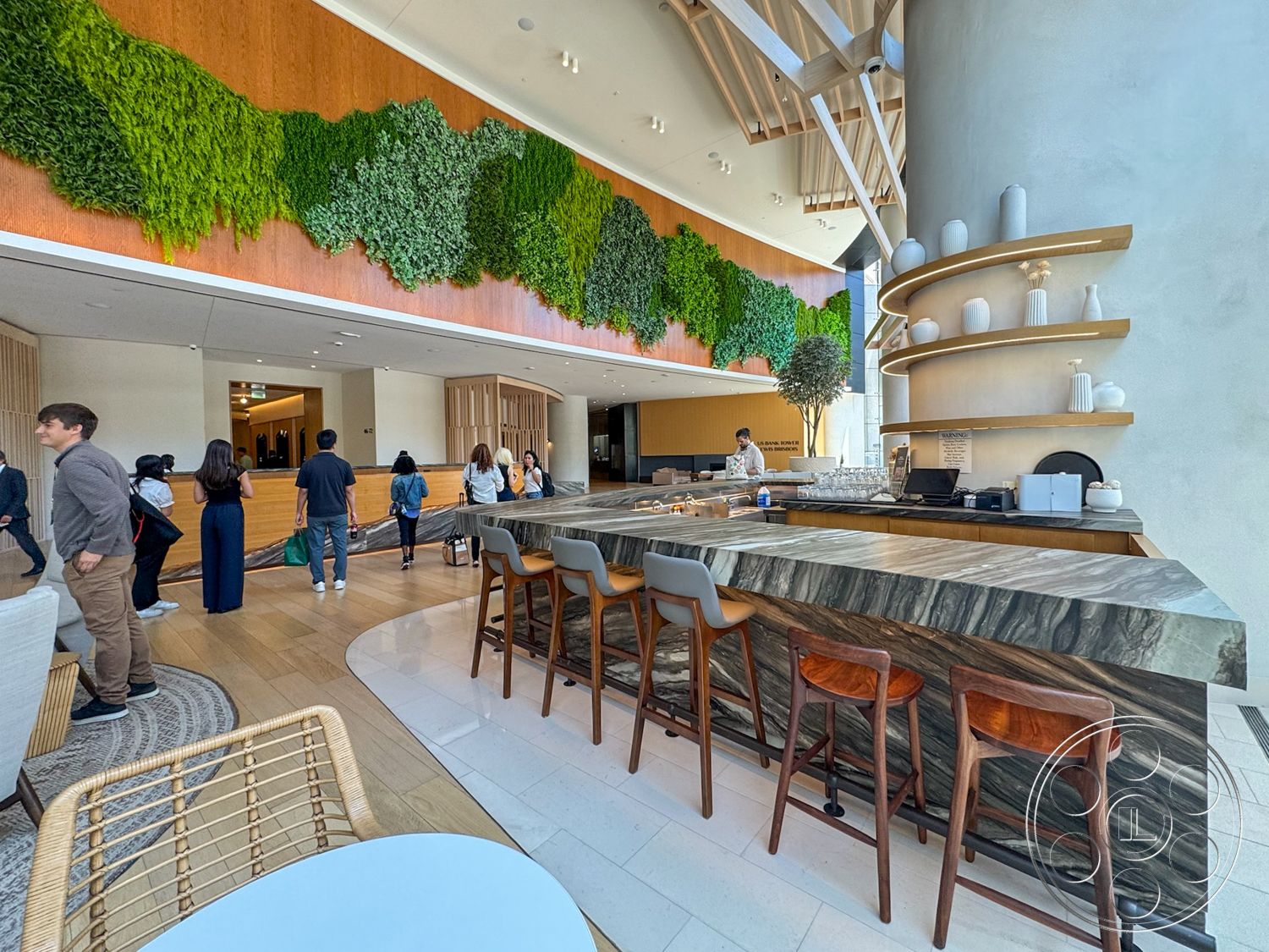 Office 123 - minimalist design, wooden bar stools, light hardwood flooring, floor-to-ceiling windows, contemporary architecture, decorative shelving, textured plaster walls, wooden bar counter, exposed wood ceiling beams, open layout design, dark stone bar top, lush vertical garden wall