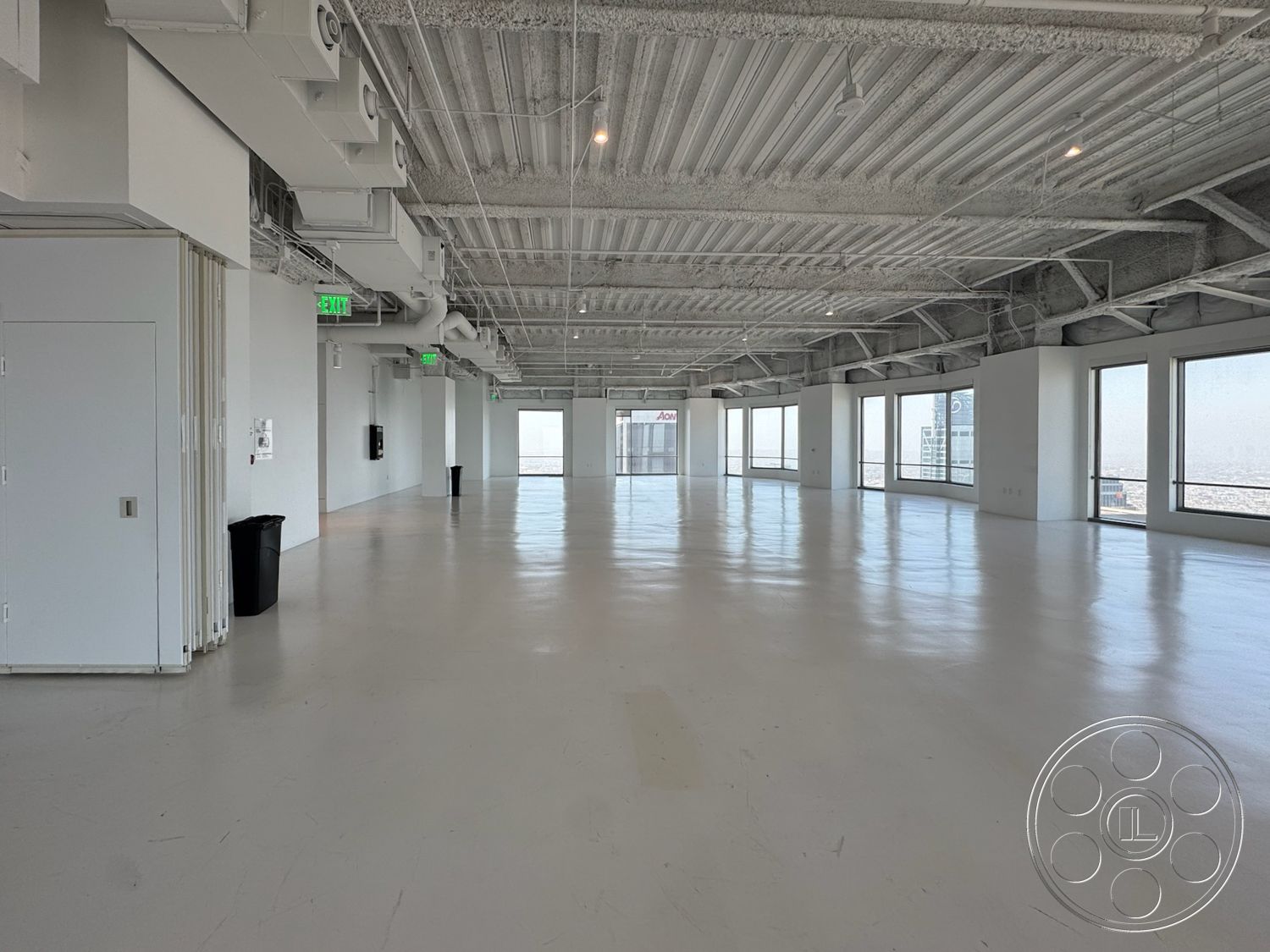 Office 123 - minimalist design, polished concrete floor, open floor plan, floor-to-ceiling windows, exposed concrete ceiling, ventilation ducts, white painted walls, commercial office space, industrial style interior, tall ceiling height