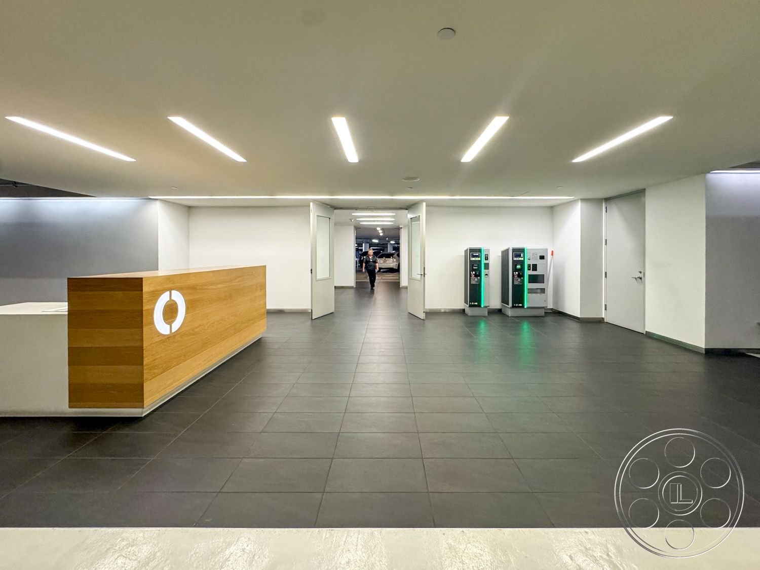 The Atrium - minimalist design, open layout, modern aesthetic, reception area, white painted walls, glass partition wall, LED ceiling lights, wood reception desk, light grey ceramic tile flooring, banking services