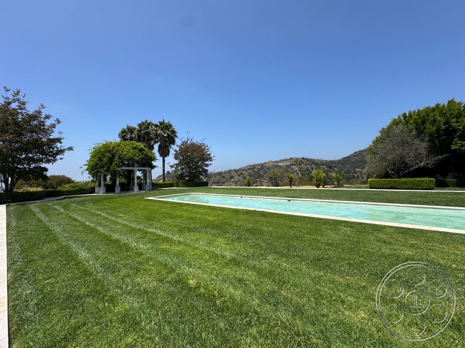 Beverly Compound - exterior, landscaped garden, stone patio, grass lawn, mountain view, native trees, infinity pool, hillside location, concrete pool border, outdoor pergola
