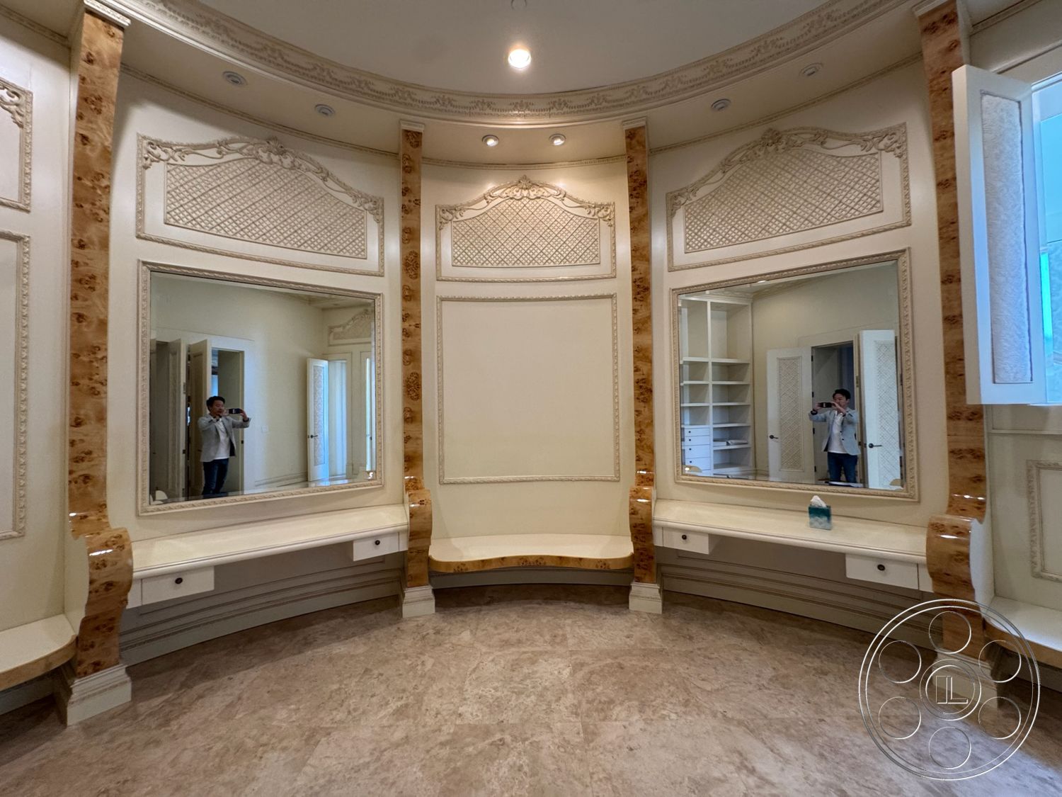 Beverly Compound - neutral color palette, light fixtures, curved wall design, marble floor, large wall mirrors, built-in seating area, decorative ceiling details, ornate wall molding, custom cabinet storage