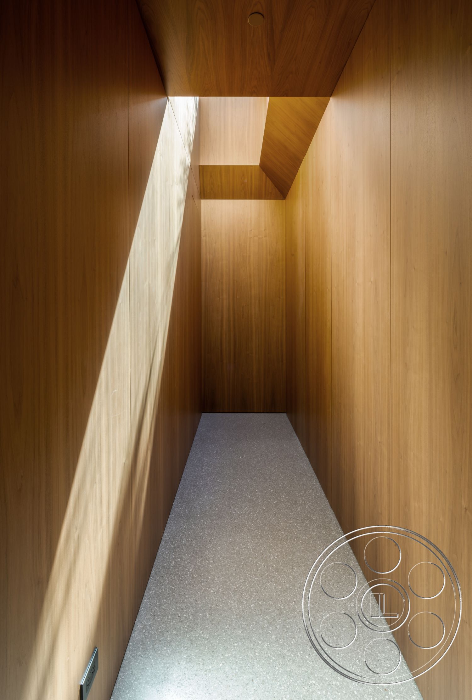 Modern 516 - terrazzo flooring, natural light source, wood panel walls, smooth wood ceiling, angular hallway shape